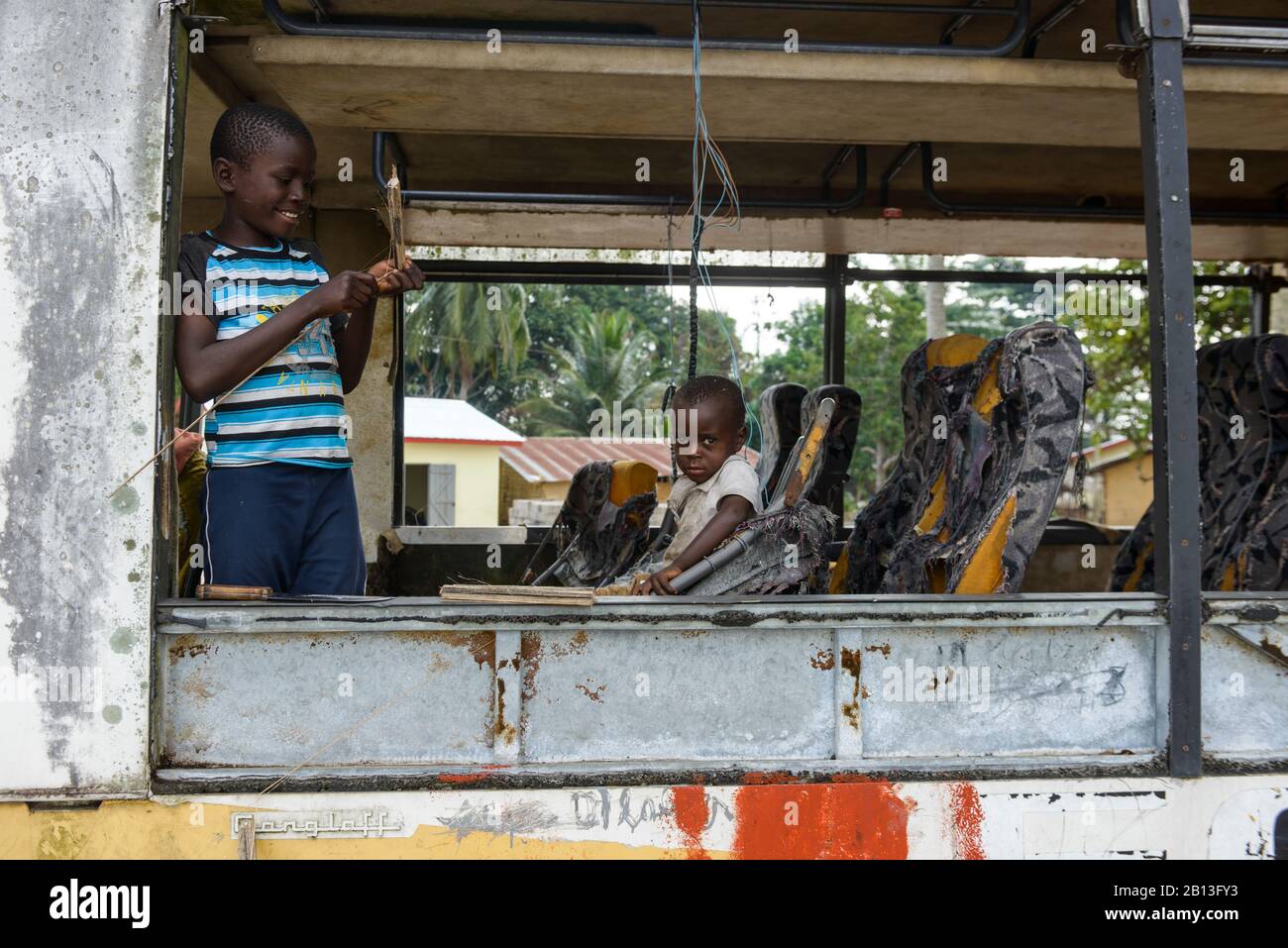 Children are playing in an old bus,Democratic Republic of the Congo,Africa Stock Photo
