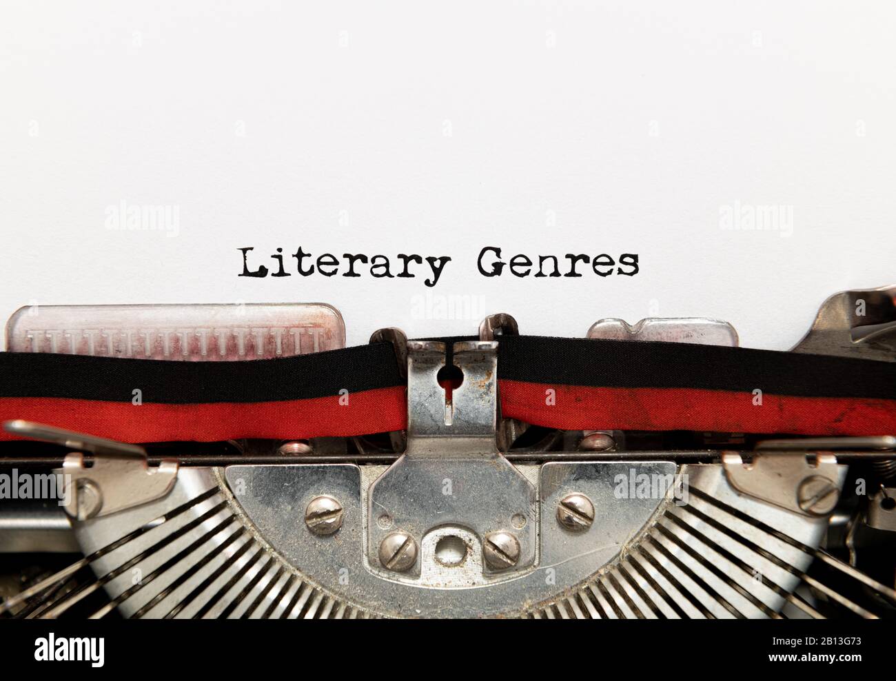Close up of literary genres title text printed on white paper with vintage typewriter Stock Photo