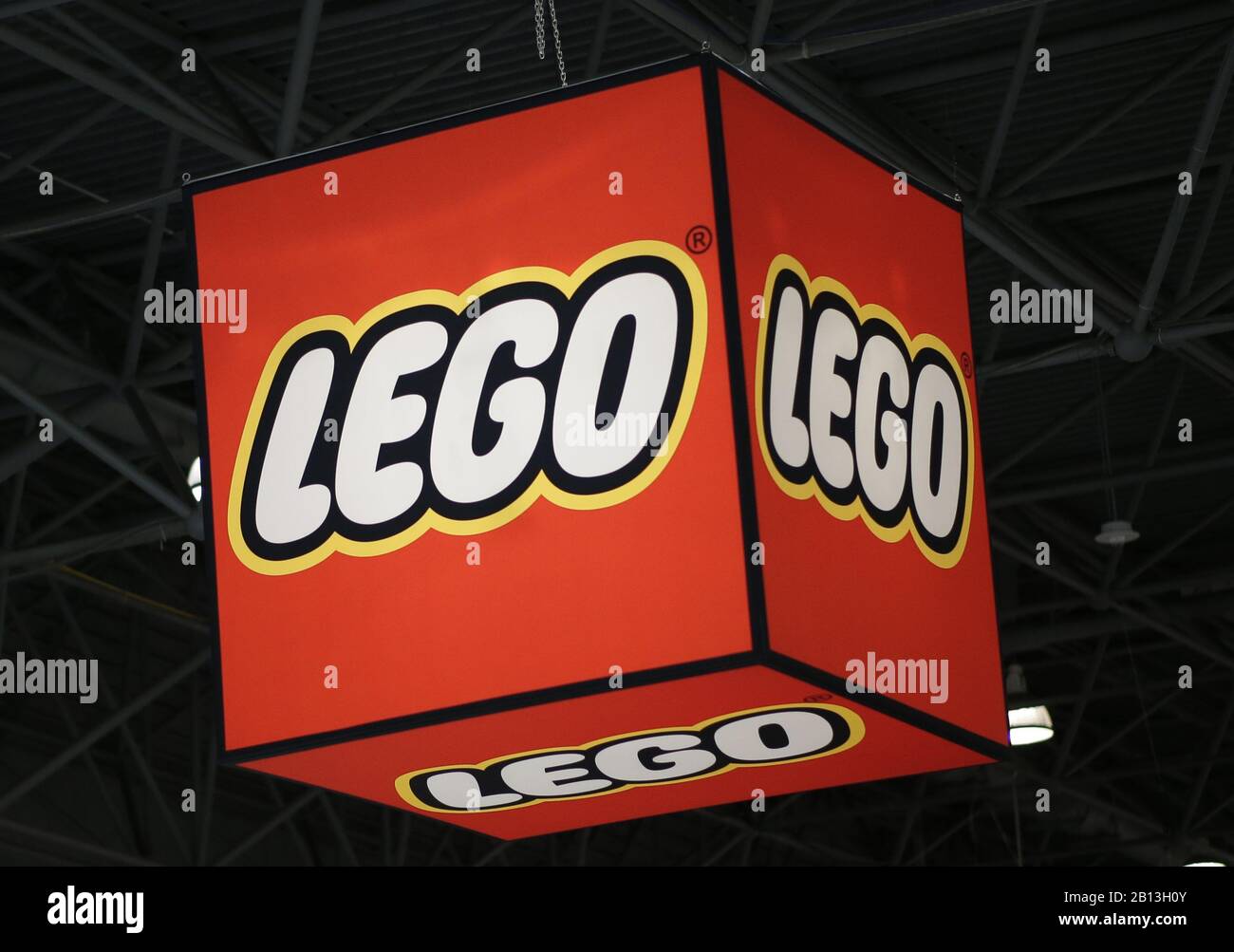 New York, United States. 22nd Feb, 2020. A Lego logo hangs above attendees  at 117th American International Toy Fair at the Jacob K. Javits Convention  Center in New York City on Saturday,