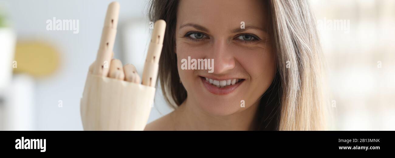 Smiling woman with prosthetic arm Stock Photo