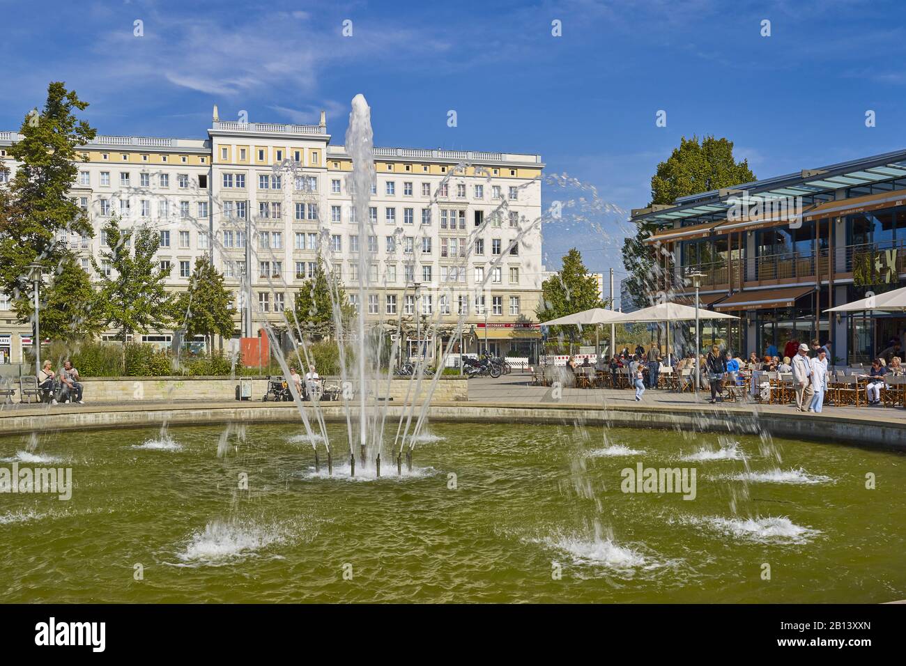 Cafe on Ulrichplatz with building in the architectural style of Socialist Classicism,Magdeburg,Saxony-Anhalt,Germany Stock Photo