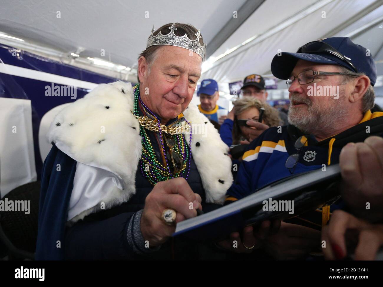 https://c8.alamy.com/comp/2B13Y4H/st-louis-united-states-22nd-feb-2020-former-st-louis-blues-and-member-of-the-national-hockey-hall-of-fame-bernie-federko-signs-an-autograph-for-a-fan-during-the-st-louis-mardi-gras-parade-in-st-louis-on-saturday-february-22-2020-the-st-louis-blues-winner-of-the-2019-stanley-cup-were-the-theme-of-the-mardi-gras-parade-with-federko-serving-as-the-grand-marshall-photo-by-bill-greenblattupi-credit-upialamy-live-news-2B13Y4H.jpg
