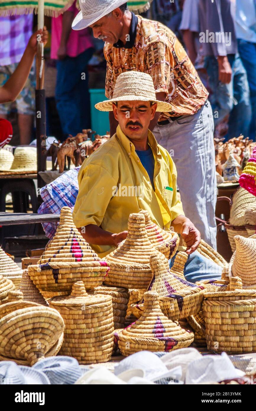 Marrakech, Morocco - September 9th 2010: Man selling basketware in the souk. The city is a popular tourist destination Stock Photo