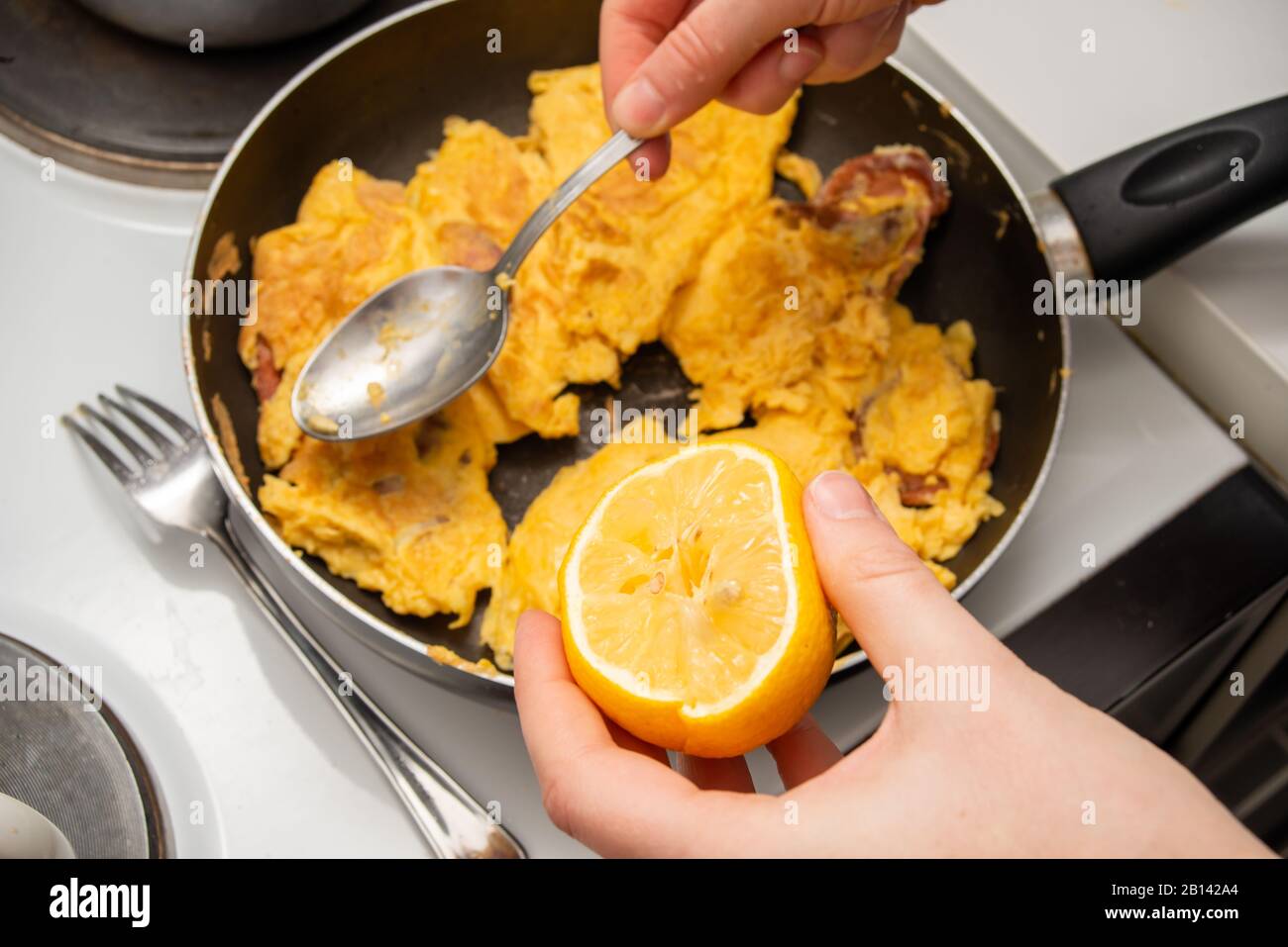 Person making scrambled eggs hires stock photography and images Alamy