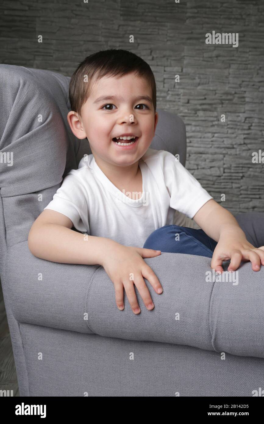 Little boy on sofa hi res stock photography and images Alamy