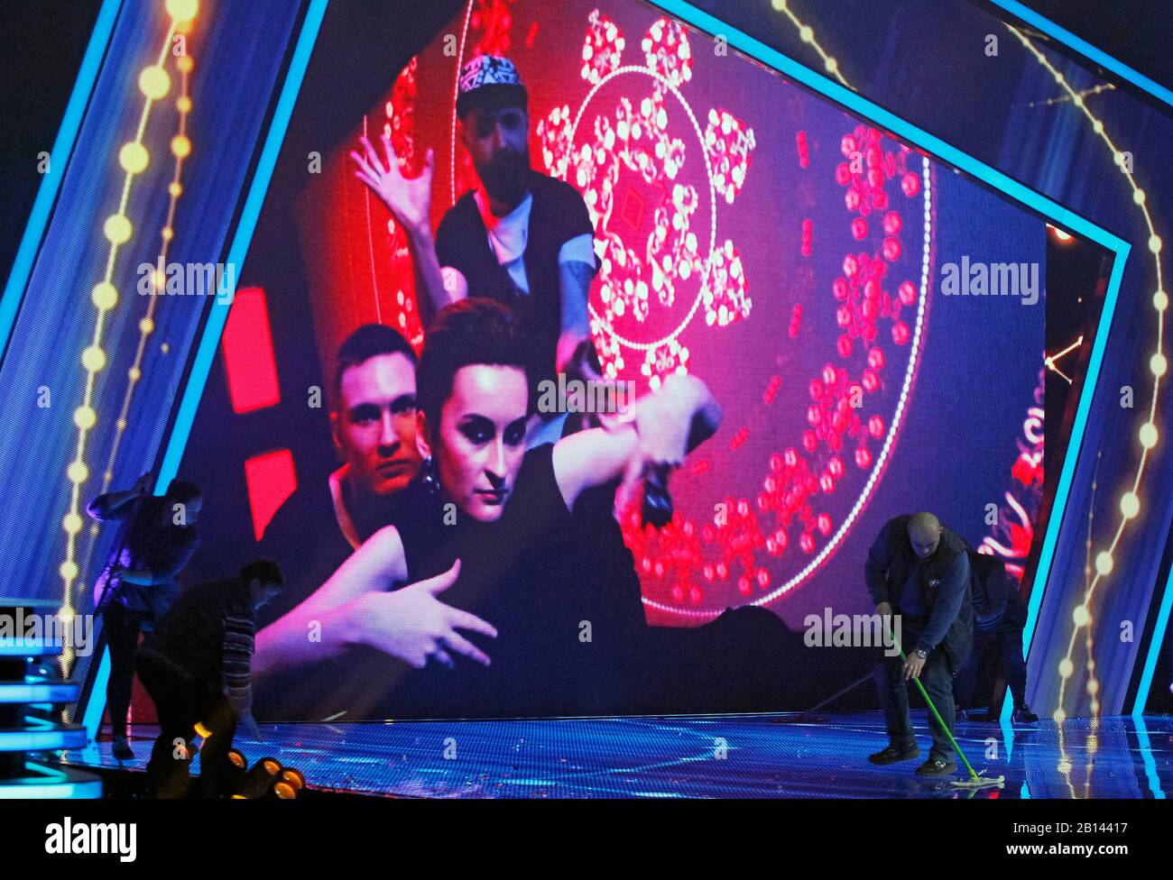 Kiev, Ukraine. 22nd Feb, 2020. Members of Ukrainian band Go A is seen on a screen video as workers clean the stage during the 2020 Eurovision Song Contest (ESC) national selection show in Kiev.Ukrainian band Go A with song Solovey will represent Ukraine at the 2020 Eurovision Song Contest (ESC) in Netherlands. The 65th anniversary Eurovision song contest will be held in Rotterdam (Netherlands) from May 12 to May 16, 2020. Ukraine, which missed the competition last year, intends to return to participation in 2020. Credit: SOPA Images Limited/Alamy Live News Stock Photo