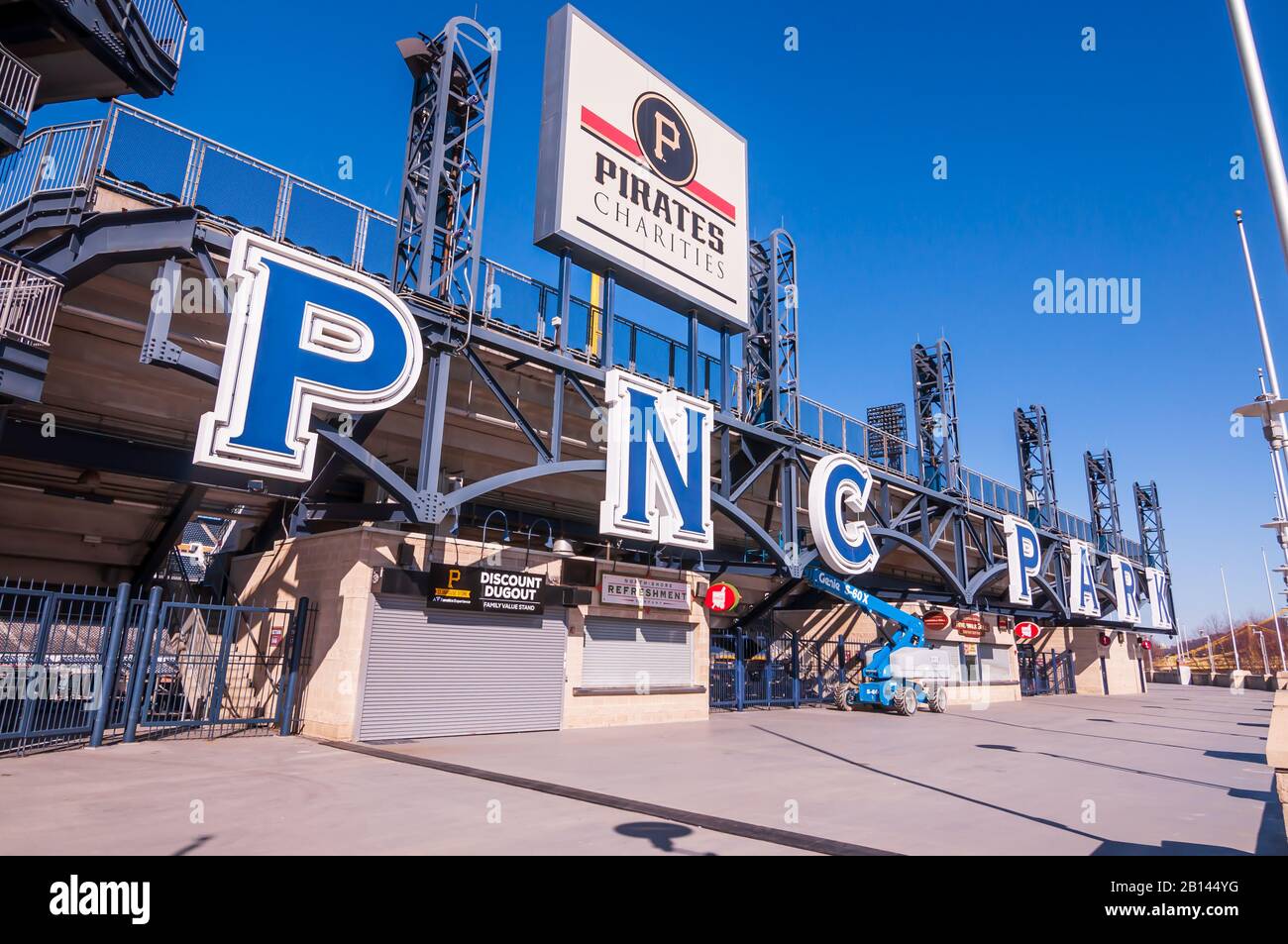 The PNC Park and Pirates Charity sign above the outfield walkway on a