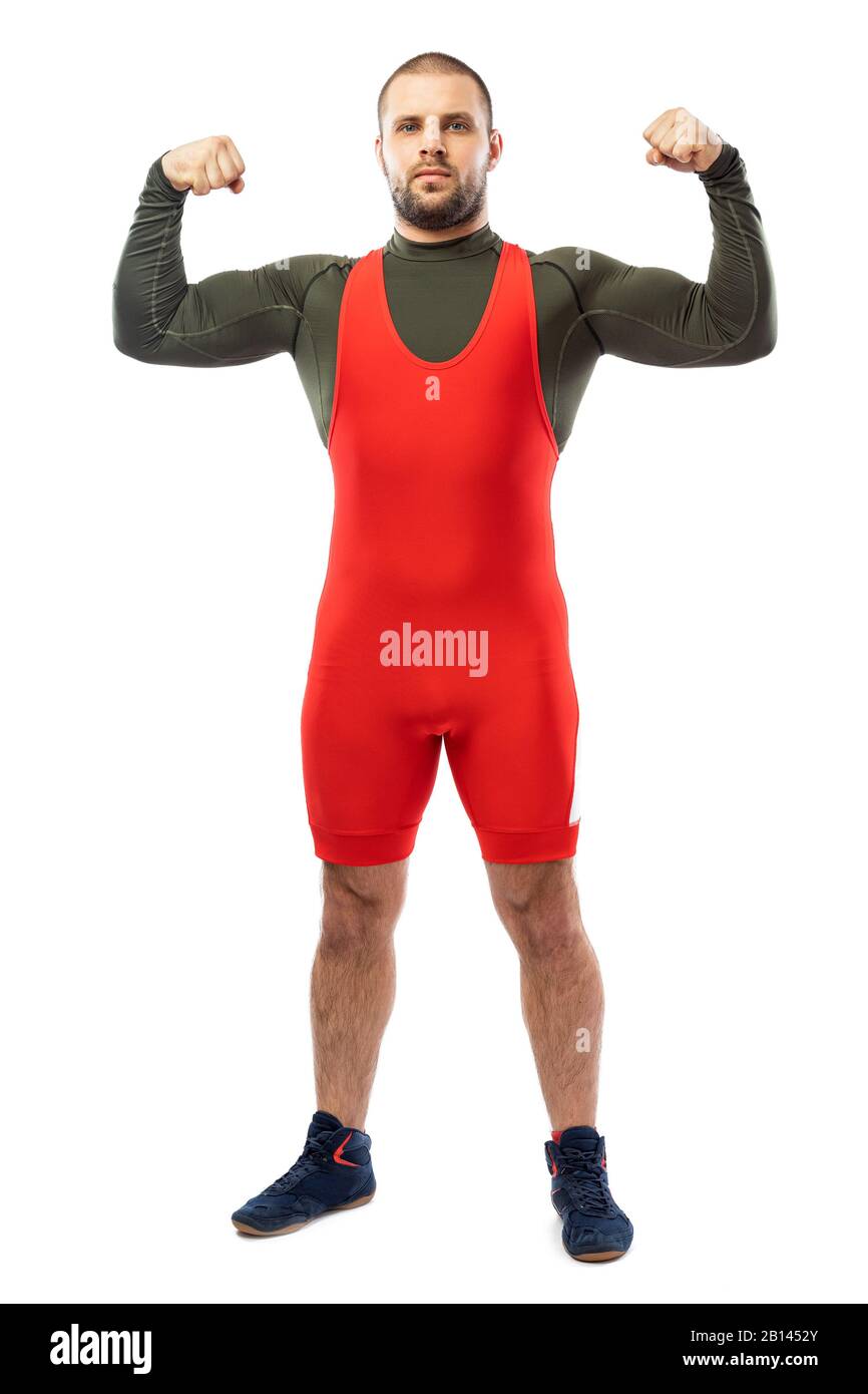 Strong strong young man in a sports red tights stands showing biceps, looking confidently forward on a white isolated background. Concept of athlete, Stock Photo