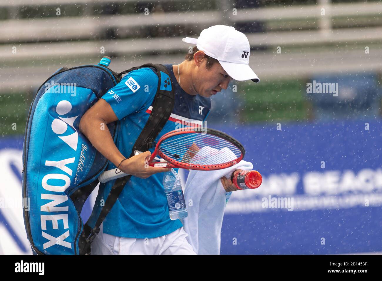 FEBRUARY 22 - Delray Beach: Yoshihito Nishioka(JPN) runs off the court during the rain delay while playing Ugo Humbert(FRA) at the 2020 Delray Beach Open by Vitacost.com in Delray Beach, Florida.Credit: Andrew Patron/MediaPunch Stock Photo
