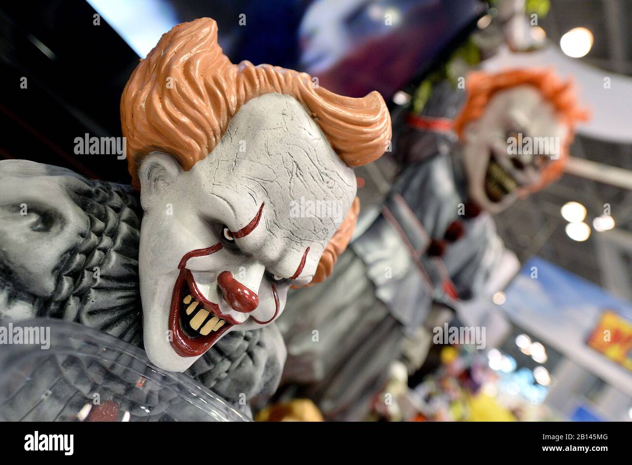 It” evil clownfilm character “Pennywise” heads on display at a costume and  maks vendor during the annual New York Toy Fair 2020, at the Jacob K.  Javits Convention Center in New York,