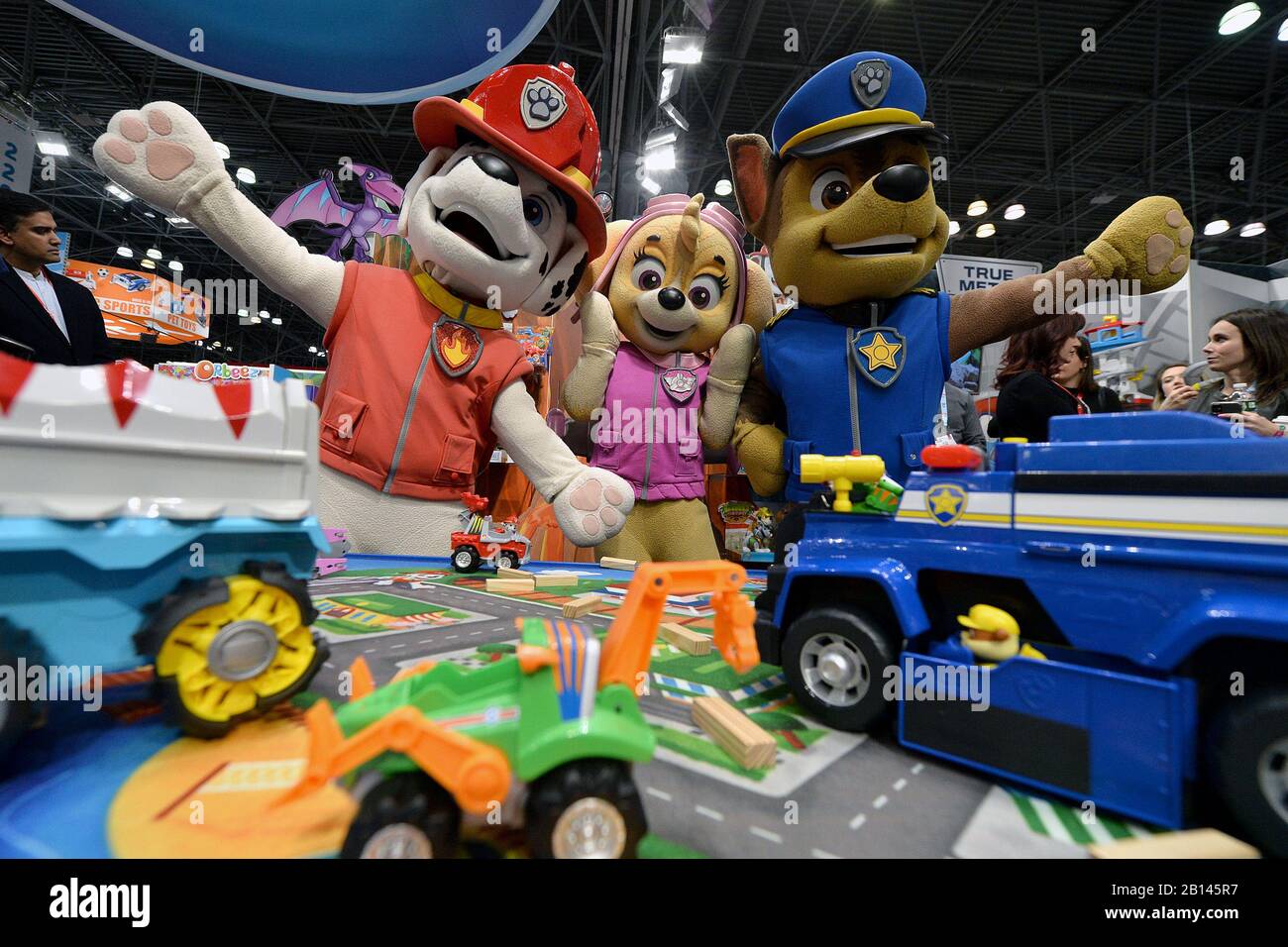 Costumed characters Marshal, Sky and Chase from the children's animated  series 'Paw Patrol” interact with customers