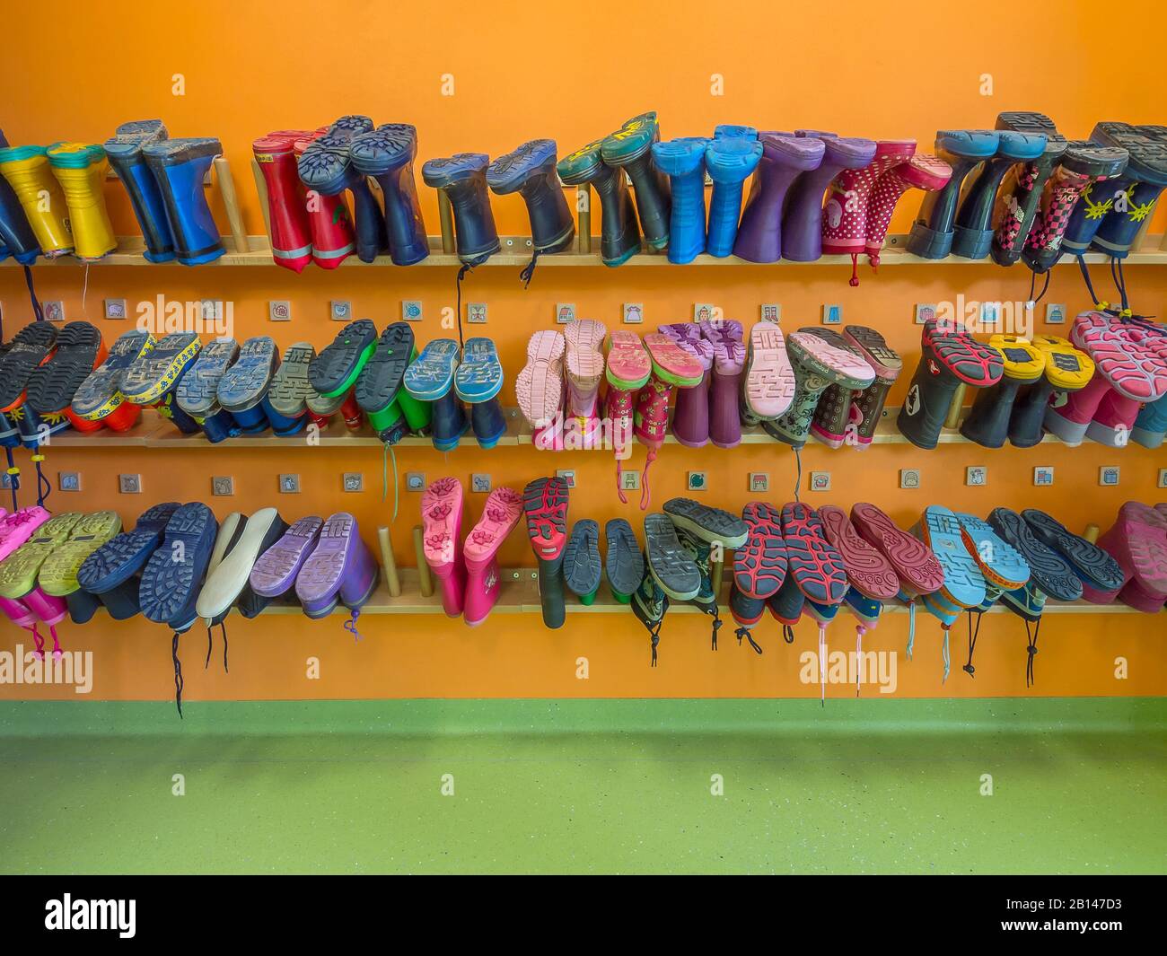 Kindergarten, rubber boots, shelf Stock Photo