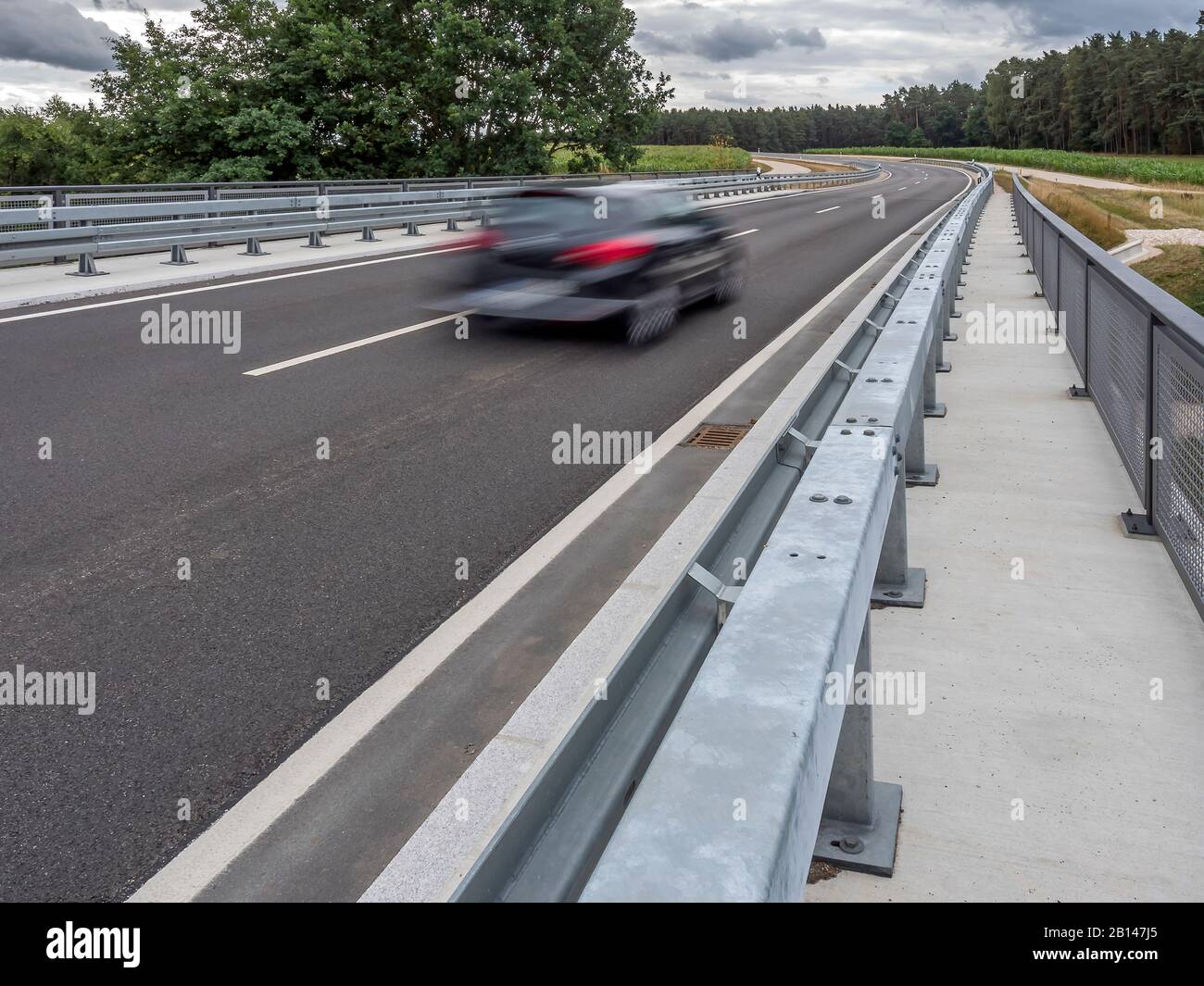 Road, country road, expressway, car fast, guardrail Stock Photo
