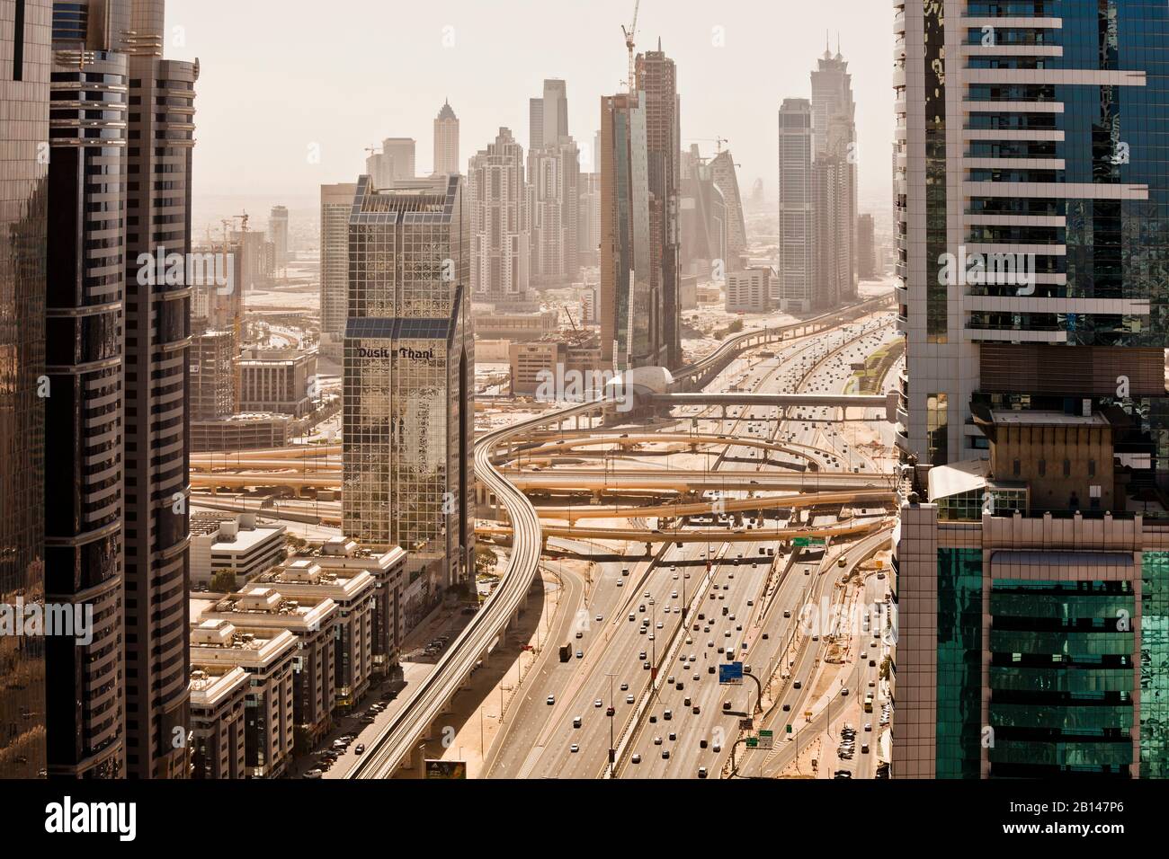 Highway Sheikh Zayed Road and metro line in Dubai, edged by skyscrapers