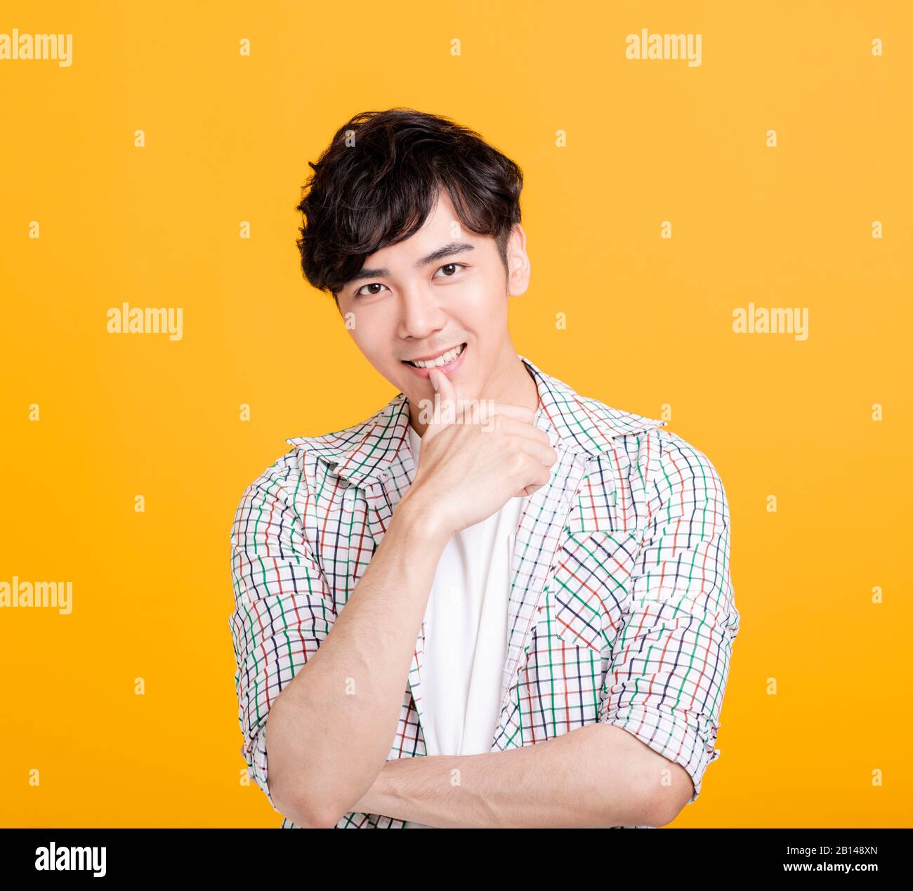 Portrait of handsome young man smiling Stock Photo - Alamy