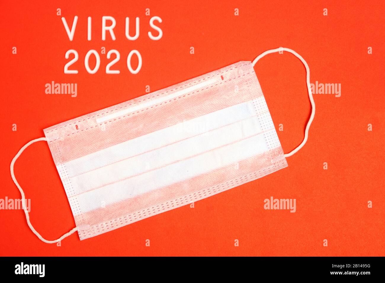 Medical mask for protection and the inscription virus 2020 on a red ...