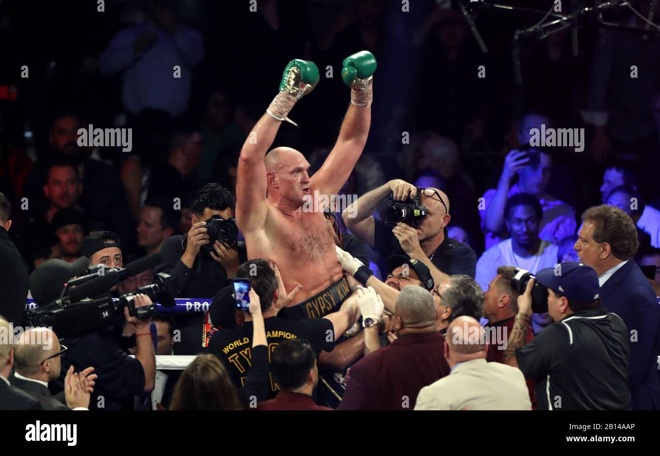 Tyson Fury (centre) celebrates defeating Deontay Wilder in the World Boxing Council World Heavy Title bout at the MGM Grand, Las Vegas. Stock Photo