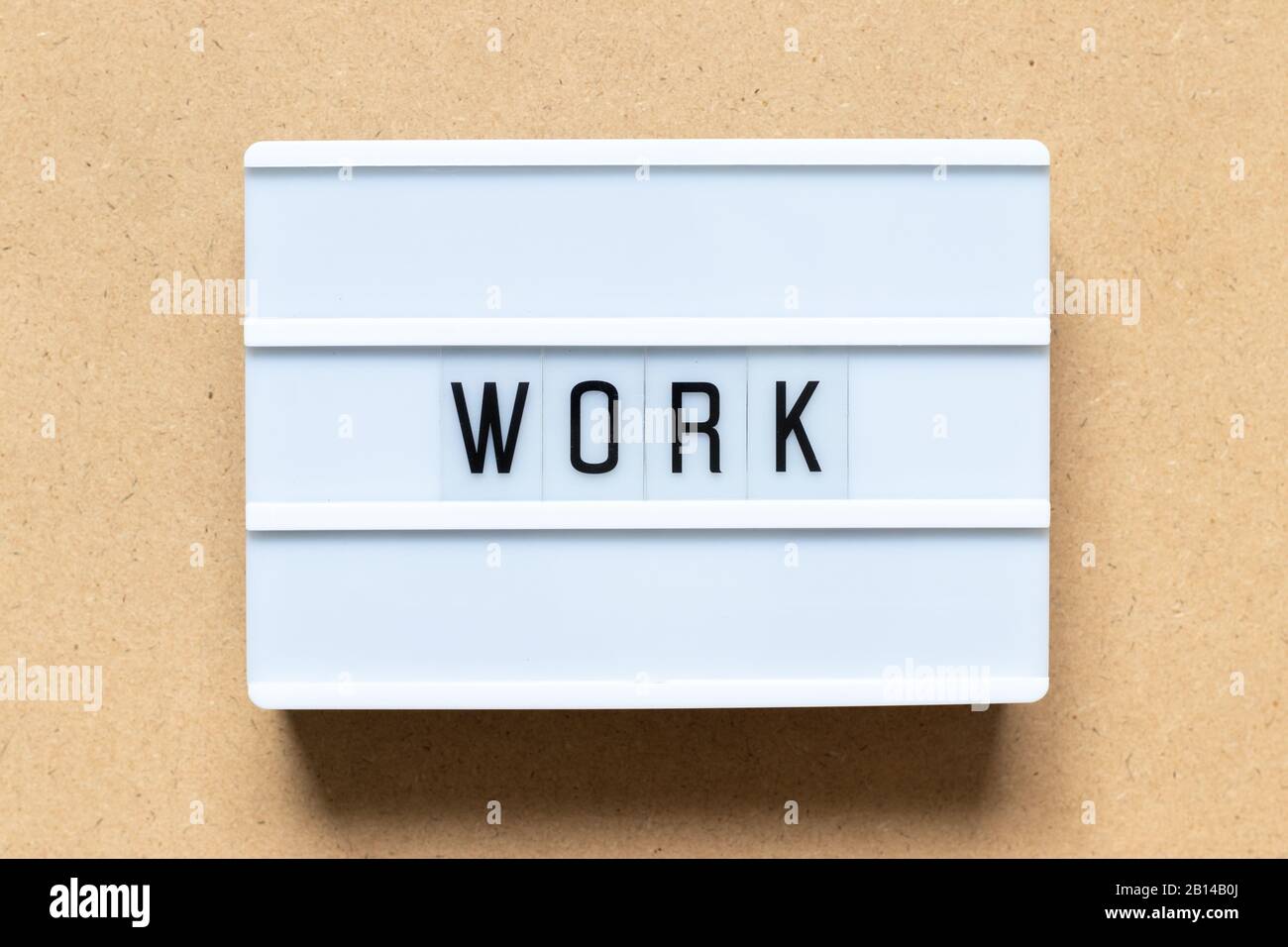 White lightbox with word work on wood background Stock Photo