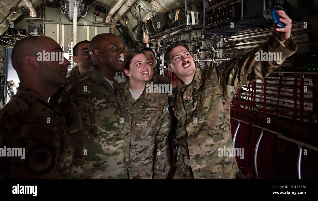 Chief Master Sgt. of the Air Force Kaleth O. Wright takes a photo with 455th Expeditionary Aeromedical Evacuation members during a tour of a C-130J Hercules aircraft April 13, 2017, at Bagram Airfield, Afghanistan. This was Wright’s first visit to Bagram since being selected as the 18th chief master sergeant of the Air Force. (U.S. Air Force photo by Staff Sgt. Katherine Spessa) Stock Photo