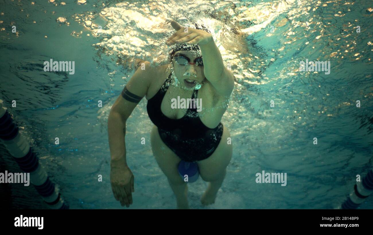 U.S. Marine Corps Cpl. Jessia Ocasil, of Wounded Warrior Battalion East and a Paterson, N.J., native, practices her freestyle stroke ahead of the 2018 Marine Corps Trials swim competition in the Wallace Creek pool at Camp Lejeune, N.C., March 19, 2018. The Marine Corps Trials promotes recovery and rehabilitation through adaptive sport participation and develops camaraderie among recovering service members (RSMs) and veterans. It is an opportunity for RSMs to demonstrate their achievements and serves as the primary venue to select Marine Corps participants for the DoD Warrior Games. (U.S. Marin Stock Photo