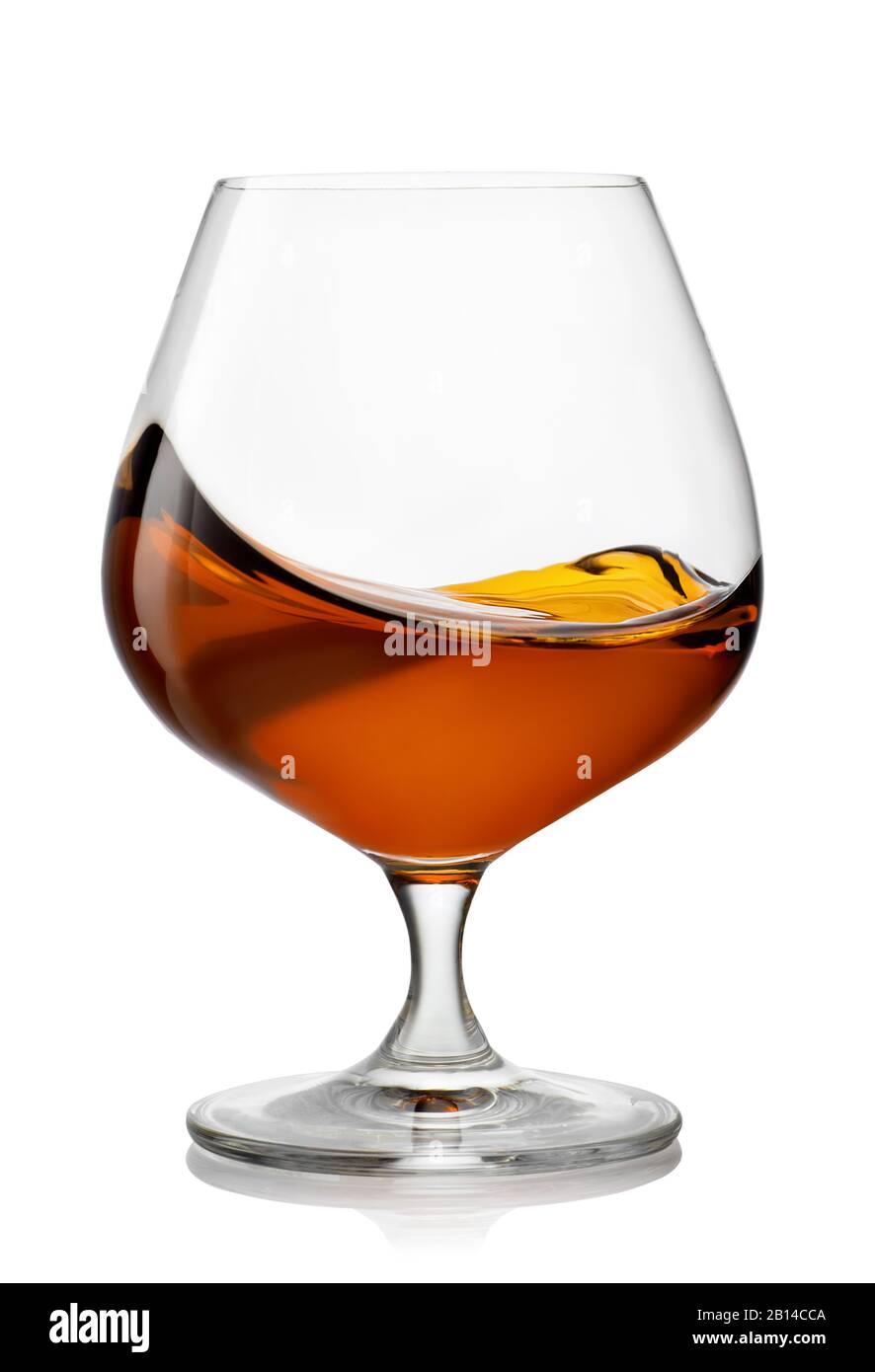 splash of brandy in snifter glass Stock Photo