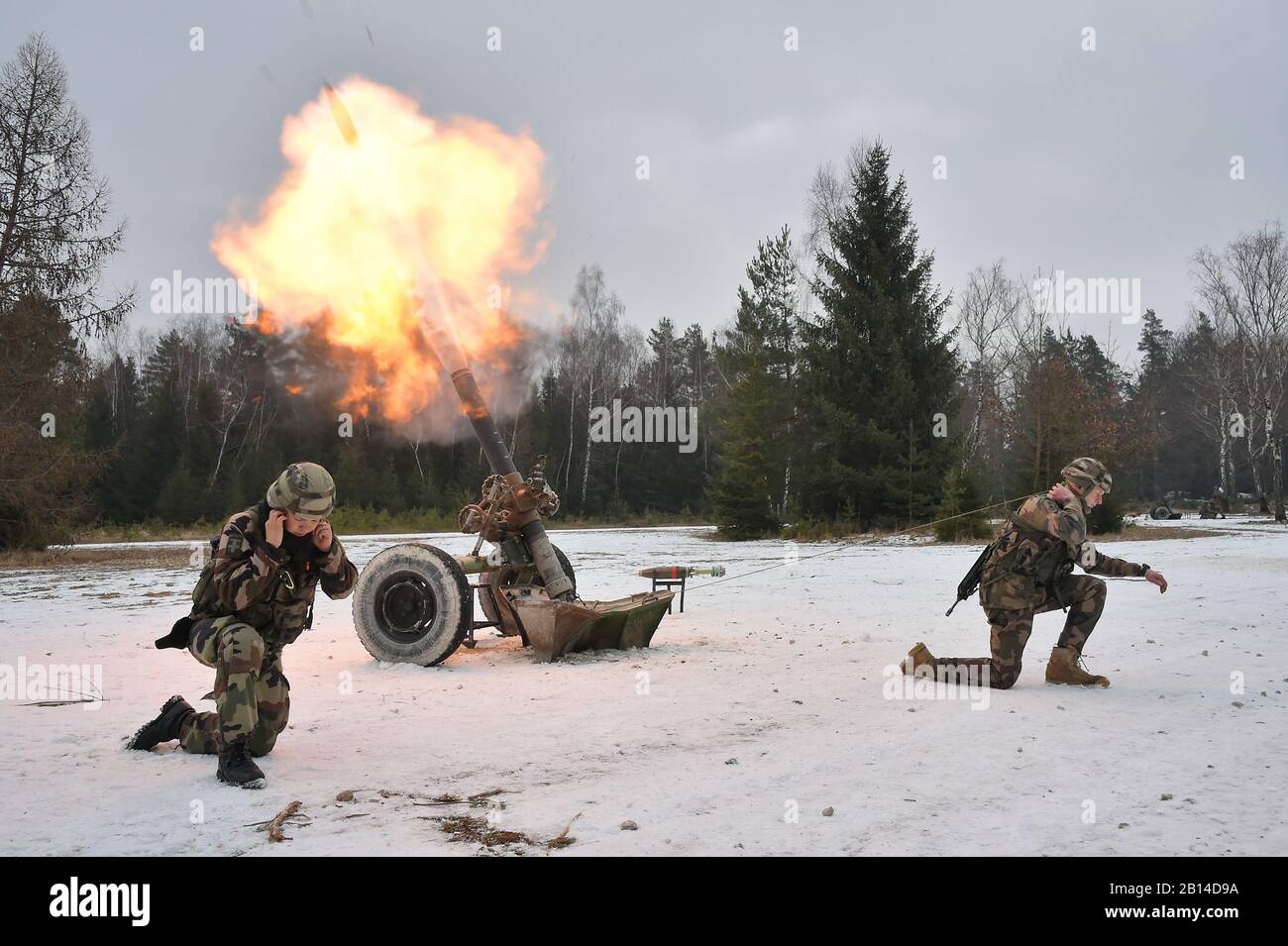 French soldiers conduct fire missions with a 120mm mortar as part of Exercise Dynamic Front 18 at the U.S. Army’s Grafenwoehr Training Area, Germany, March 5, 2018. The Exercise includes approximately 3,700 participants from 26 nations. Dynamic Front is an annual U.S. Army Europe (USAREUR) exercise focused on the interoperability of U.S. Army, joint service and allied nation artillery and fire support in a multinational environment, from theater-level headquarters identifying targets to gun crews pulling lanyards in the field. (U.S. Army photo by Gertrud Zach) Stock Photo