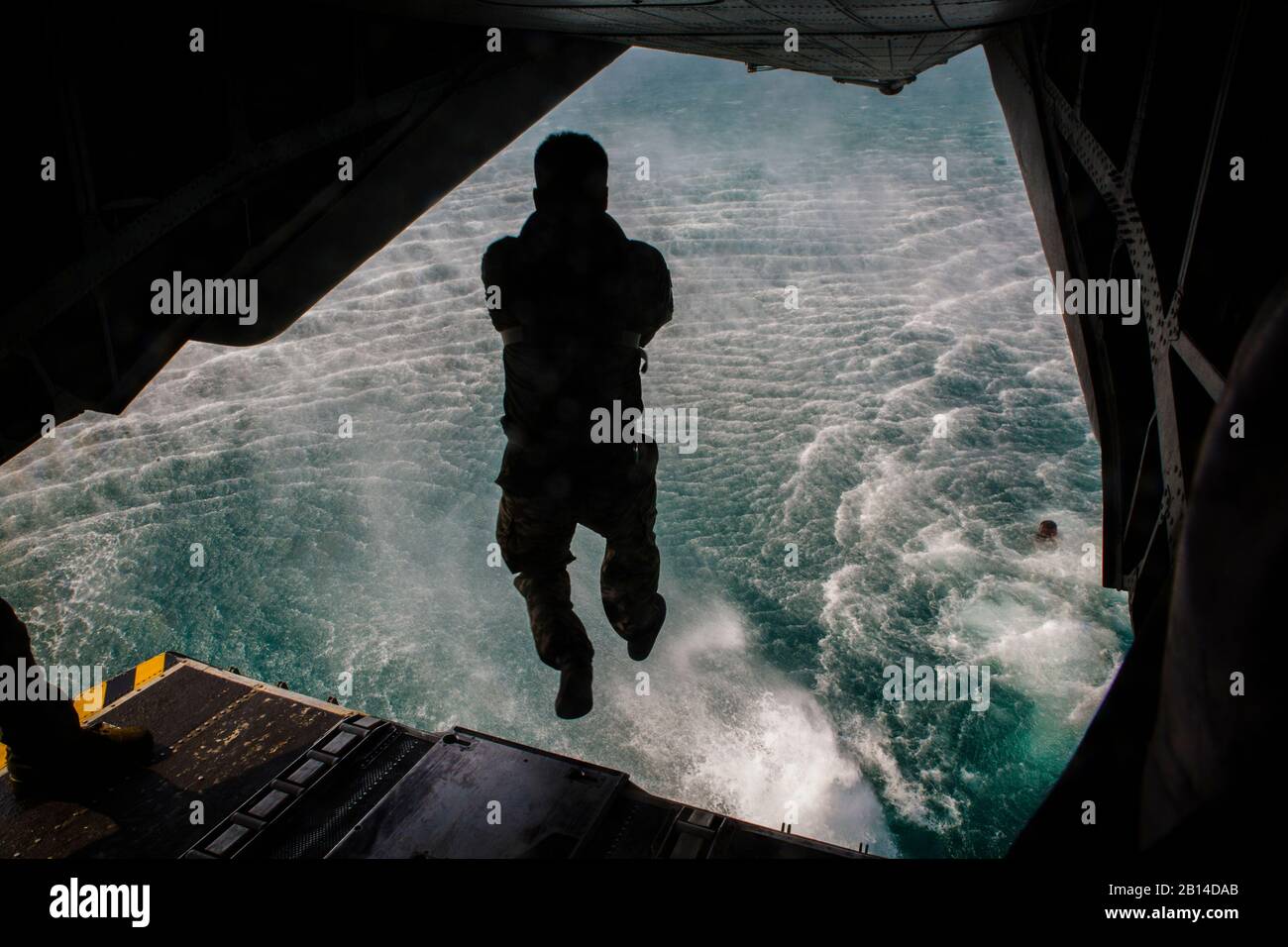 A Republic of Korea reconnaissance Marine dives off a CH-53E Super Stallion at the Sattahip district in the Chonburi province, Kingdom of Thailand, Feb. 12, 2018. Marine Heavy Helicopter Squadron 466 ‘Wolfpack’ supported helocast training with the U.S., Thai, and ROK Marine Corps reconnaissance teams. The CH-53E Super Stallion is assigned to HMH-466, Marine Aircraft Group 16, 3rd Marine Aircraft Wing, currently forward deployed under the unit deployment program with MAG-36, 1st MAW, based out of Okinawa, Japan. Exercise Cobra Gold 2018 is an annual exercise conducted in the Kingdom of Thailand Stock Photo