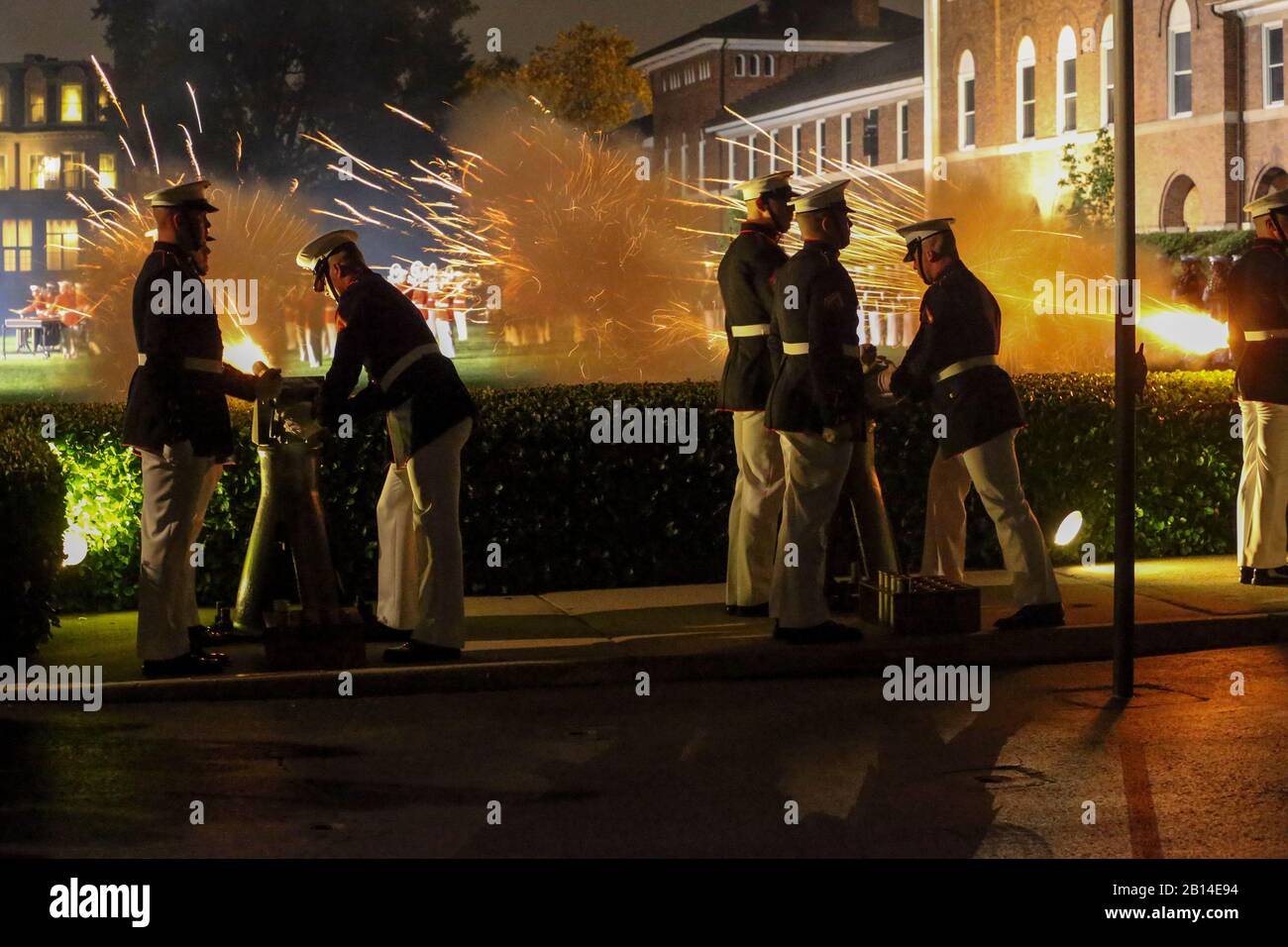 U.S. Marine Corps Body Bearers with Bravo Company fire cannons during a Friday Evening Parade at Marine Barracks Washington, D.C., July 5, 2019. General Robert B. Neller, commandant of the Marine Corps, was the hosting official and the guest of honor was The Honorable Mr. Michael R. Pompeo, U.S. Secretary of State. (U.S. Marine Corps photo by Pfc. Allen Sanders) Stock Photo