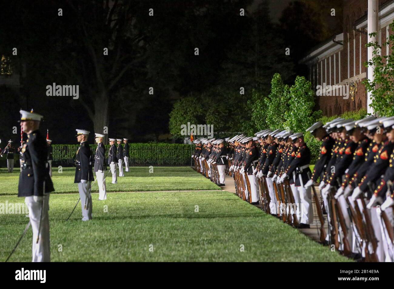 Marines with Alpha and Bravo marching companies, Marine Barracks Washington D.C., perform “fix bayonets” during a Friday Evening Parade at the Barracks, May 10, 2019.The guest of honor for the evening was the Honorable, David L. Norquist, Under Secretary of Defense (Comptroller)/Chief Financial Officer and performing the duties of the Deputy Secretary of Defense and the hosting official was the Assistant Commandant of the Marine Corps, Gen. Gary L. Thomas. (U.S. Marine Corps photo by Pfc. Allen Sanders) Stock Photo