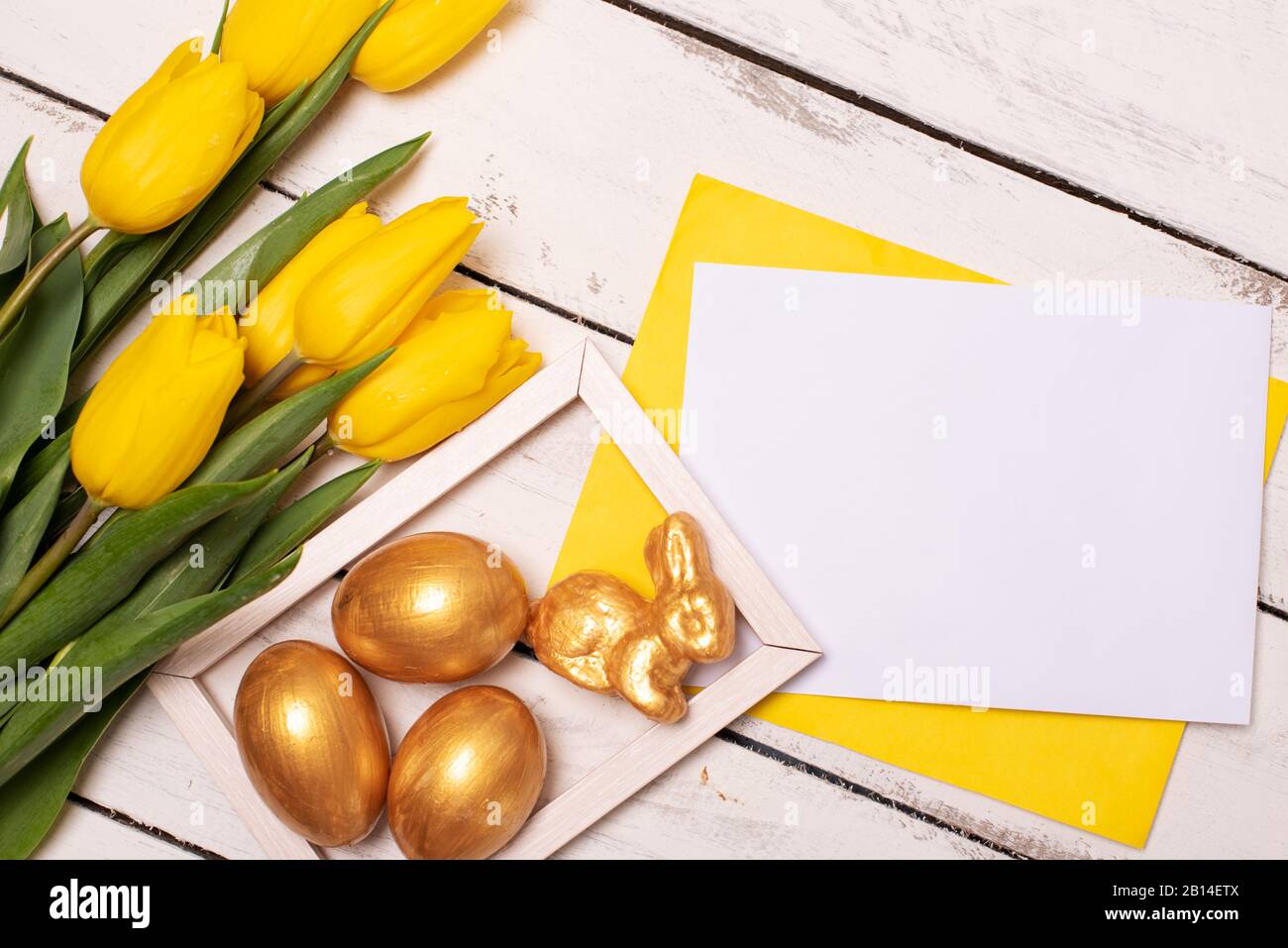 Happy Easter. Congratulatory easter background. Easter eggs and flowers Stock Photo