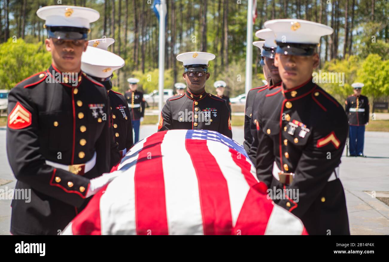 U.S. Marines with Marine Forces Reserve conduct military funeral honors for retired Lt. Col. Dennis Stegall at Southeast Louisiana Veterans Cemetery in Slidell, La., April 1, 2019. Stegall retired from the Marine Corps after 23 years of service in 2006 and continued to serve as the Marine Corps deputy comptroller for MARFORRES. (U.S. Marine Corps photo by Sgt. Dante J. Fries) Stock Photo