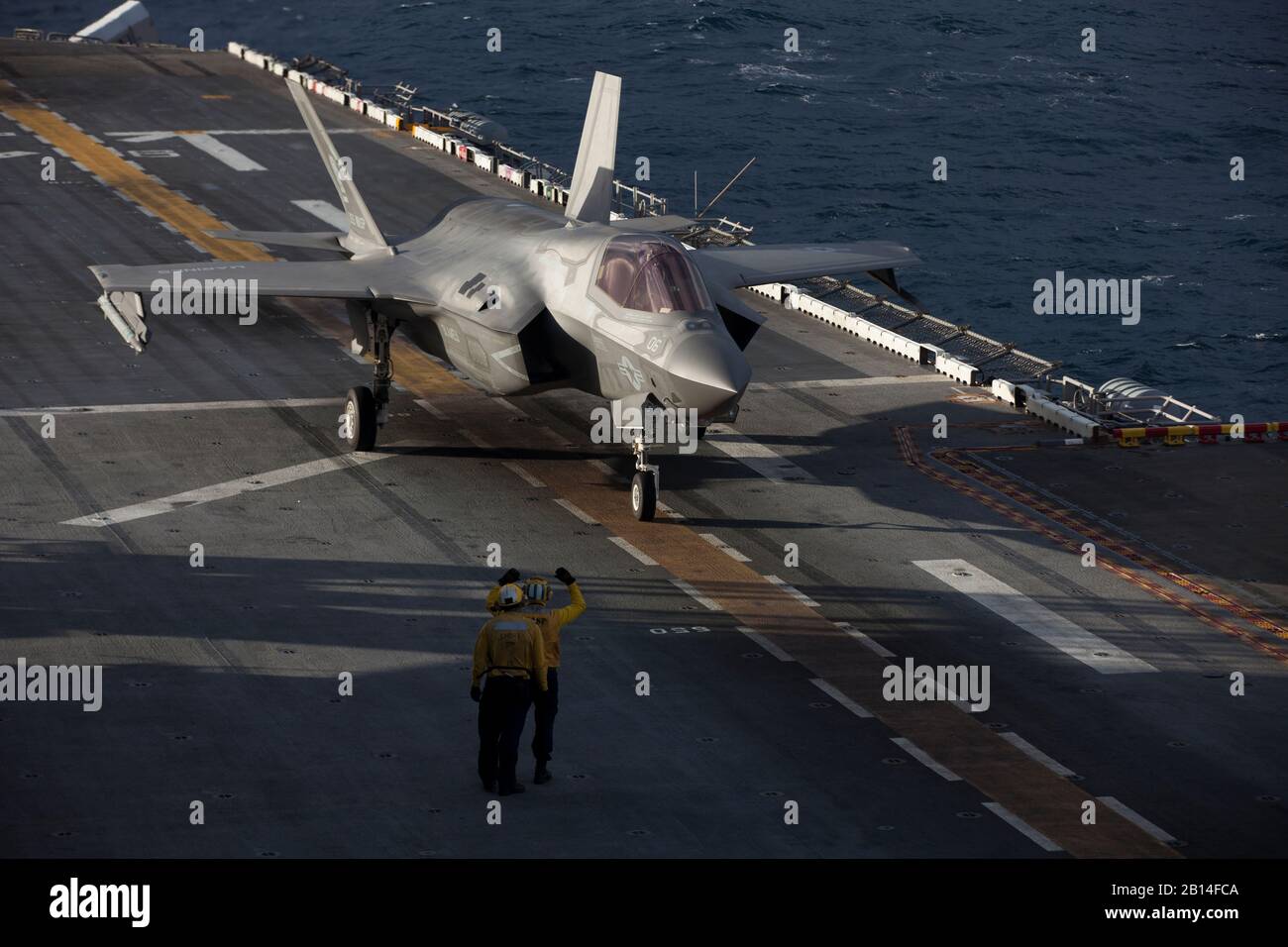 A U.S. Marine Corps F-35B Lightning II fighter aircraft with Marine Medium Tiltrotor Squadron 265 (Reinforced) prepares for launch during a Tactical Air Control Party exercise aboard the amphibious assault ship USS Wasp (LHD 1), underway in the Coral Sea, June 24, 2019. Wasp, flagship of the Wasp Amphibious Ready Group, with embarked 31st Marine Expeditionary Unit, is operating in the Indo-Pacific region to enhance interoperability with partners and serve as ready-response force for any type of contingency, while simultaneously providing a flexible and lethal crisis response force ready to per Stock Photo