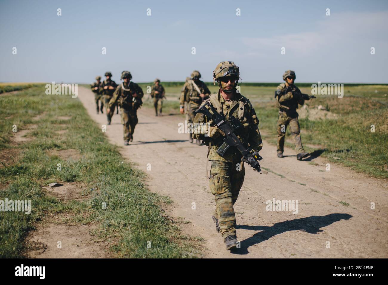 German paratroopers conduct a Joint Forcible Entry during initial operations of Exercise Swift Response 19 at Boboc, Romania, June 14, 2019. Exercise Swift Response 19 is an annual U.S. Army Europe led multinational airborne exercise being conducted in Bulgaria, Croatia and Romania with participating armed forces from France, Germany, Italy, Netherlands, Spain and the United Kingdom. Swift Response provides a vital joint training opportunity that allows command and control of complex operations from dispersed locations while ensuring that participating forces work together seamlessly to bring Stock Photo