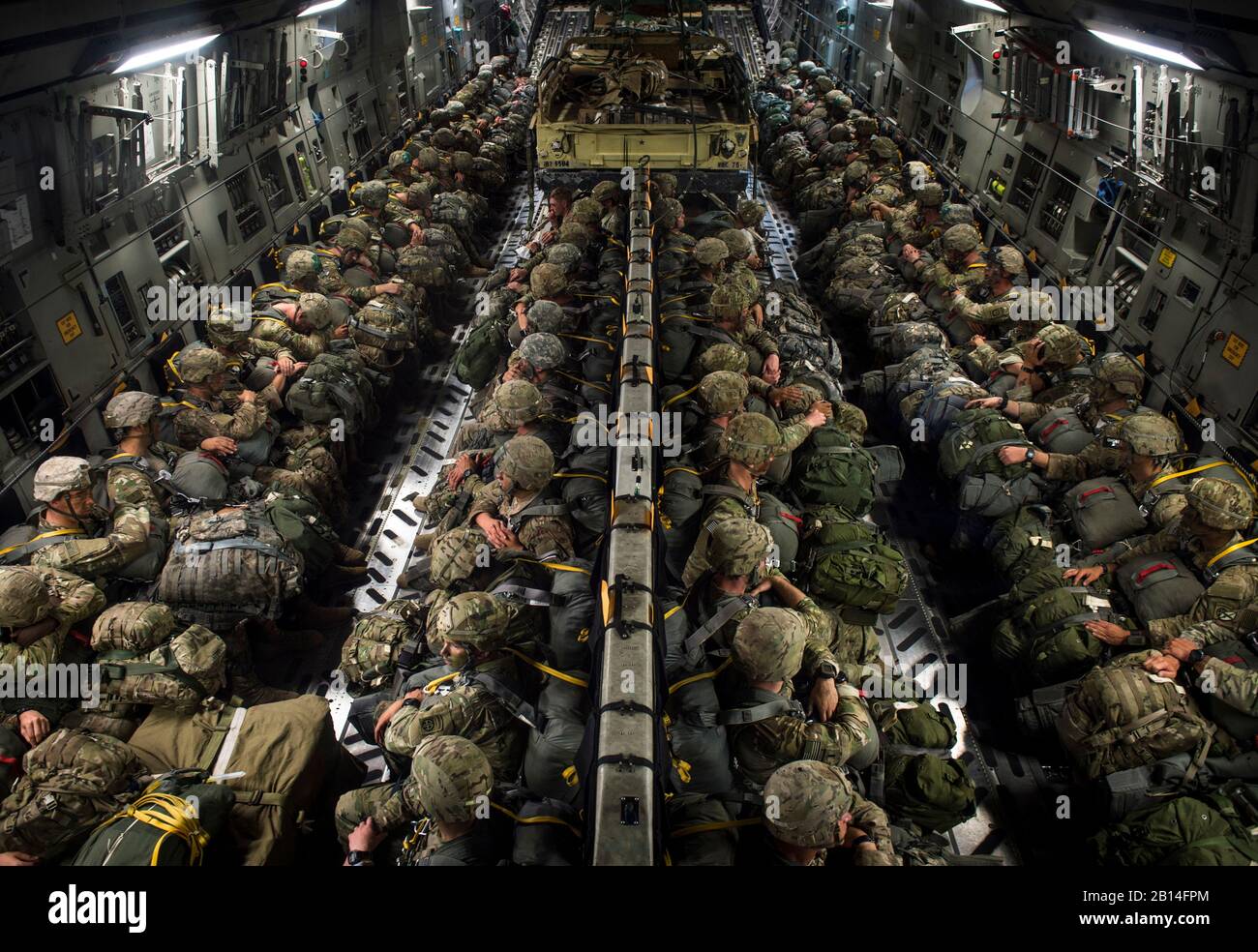 U.S. Soldiers of the 82nd Airborne Division prepare to conduct a static line jump out of a C-17 Globemaster III during exercise Panther Storm at Fort Bragg, North Carolina, July 26, 2017. The deployment readiness exercise tests the division's ability to rapidly deploy its global response force anywhere in the world within a short notice. (U.S. Air Force photo by Staff Sgt. Andrew Lee) Stock Photo