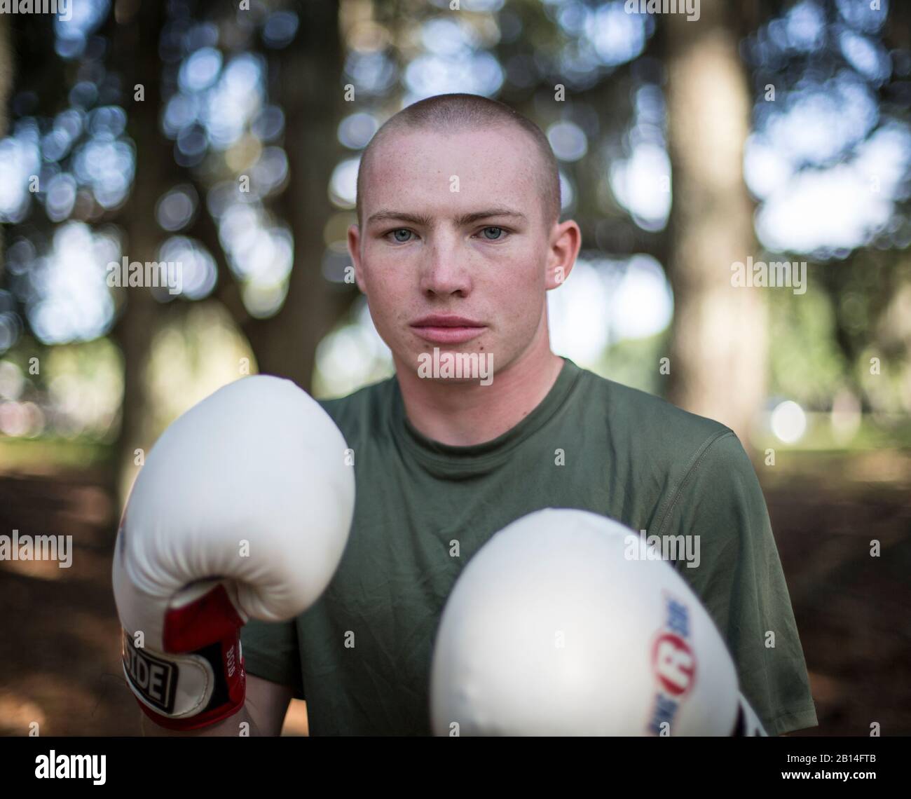 Nathan Hellams, from Liberty, S.C., a Recruit with Golf Company, 2nd Recruit Training Battalion, prepares to body spar at Marine Corps Recruit Depot Parris Island, S.C., July 11, 2019. Body sparring is an exercise that exemplifies the fundamentals of Marine Corps Martial Arts and forces recruits to overcome physical exhaustion and mental fatigue. (U.S. Marine Corps photo by Lance Cpl. Christopher McMurry) Stock Photo