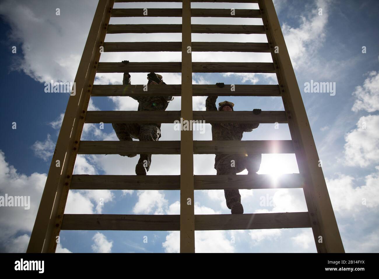 Two U.S. Marines assigned to Special Purpose Marine Air Ground Task Force-Crisis Response-Africa climb a 30-foot ladder during a fast rope exercise at Naval Station Rota, Spain, March 24, 2017. Infantry Marines maintain their fast-roping qualifications in order to remain proficient and prepare to fast rope from an aircraft as a tactical insertion method. (U.S. Marine Corps photo by Sgt. Jessika Braden) Stock Photo