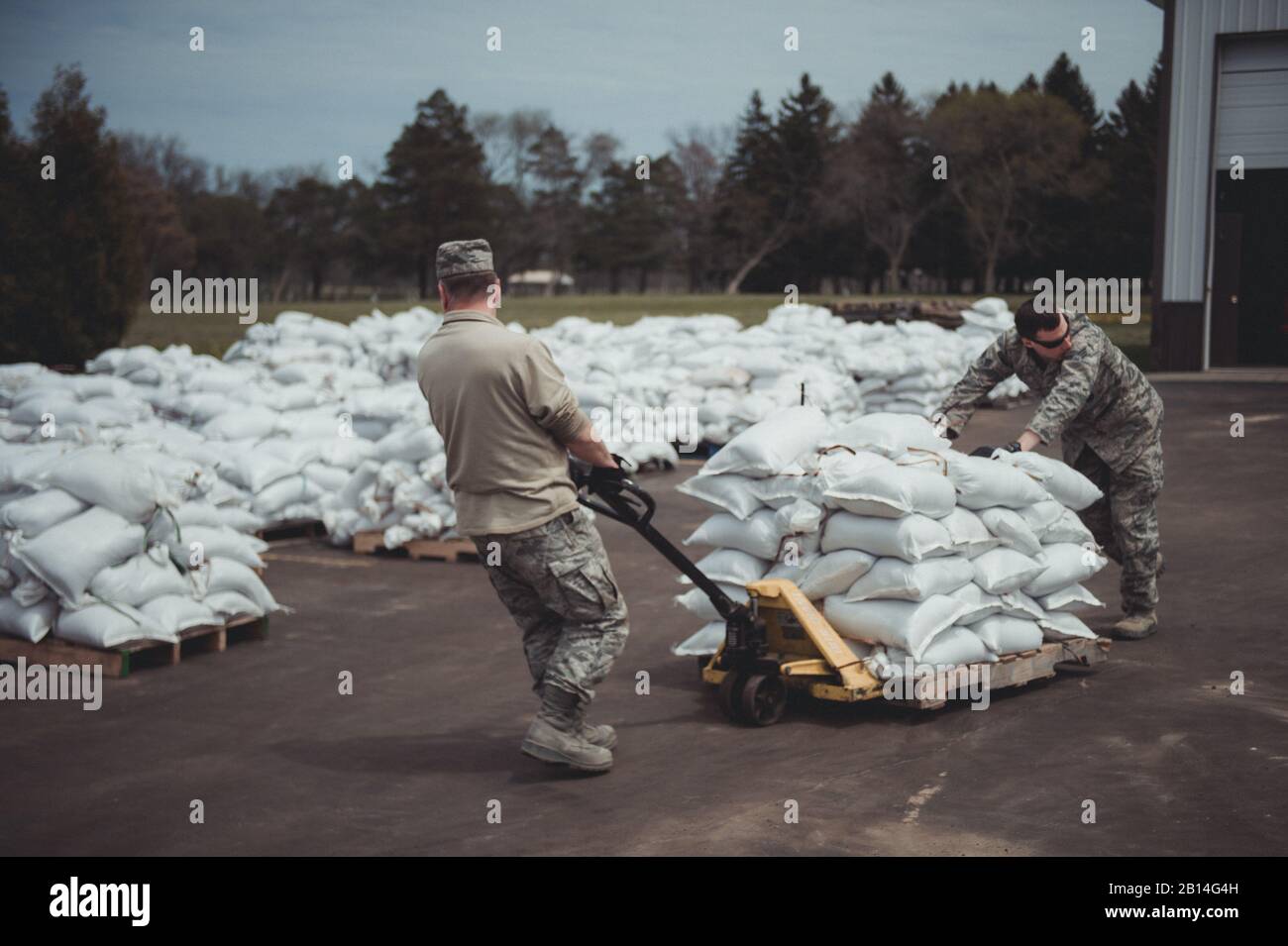 More than 30 U.S. Airmen assigned to the 107th Attack Wing, Niagara Falls Air Reserve Station, New York Air National Guard, were activated by Gov. Andrew Cuomo to respond to rising water levels in Lake Ontario which has led to flooding and a state of emergency, Olcott, N.Y., May 12, 2017. The Airmen filled more than 47,000 sandbags to be deployed throughout the Lake Ontario area to hold back flooding since being activated  May 9. (U.S. Air National Guard photo by Staff Sgt. Ryan Campbell) Stock Photo