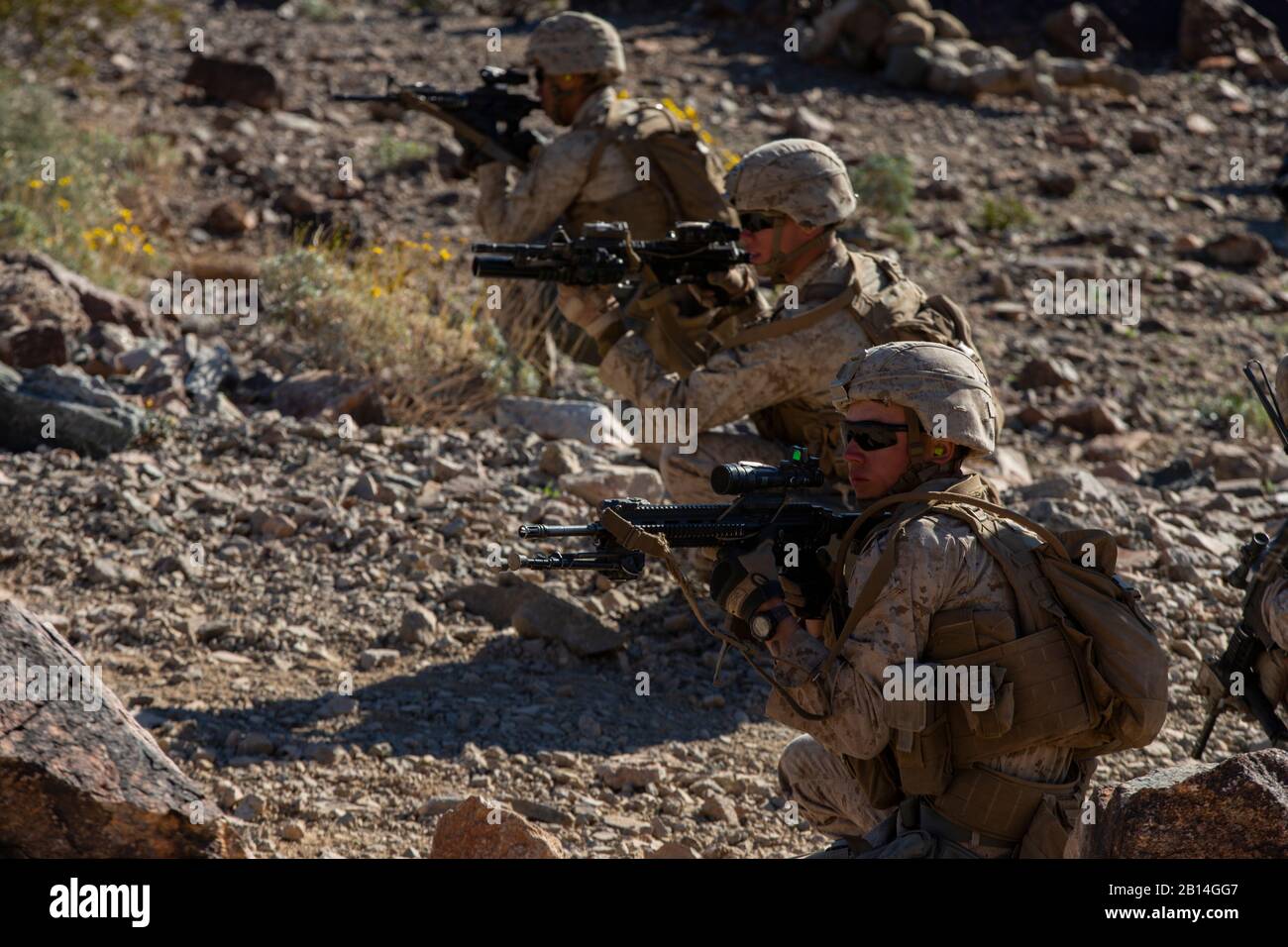 U.S. Marines with Charlie Company, 1st Battalion, 7th Marine Regiment, Marine Air-Ground Task Force-6 (MAGTF-6) provide suppressing fire while executing a company attack on Range 400 during Integrated Training Exercise (ITX) 2-19 at Marine Corps Air-Ground Combat Center Twentynine Palms, California, Jan. 25, 2019. ITX creates a challenging, realistic training environment that produces combat-ready forces capable of operating as an integrated MAGTF. (U.S. Marine Corps photo by Lance Cpl. Nathaniel Q. Hamilton) Stock Photo