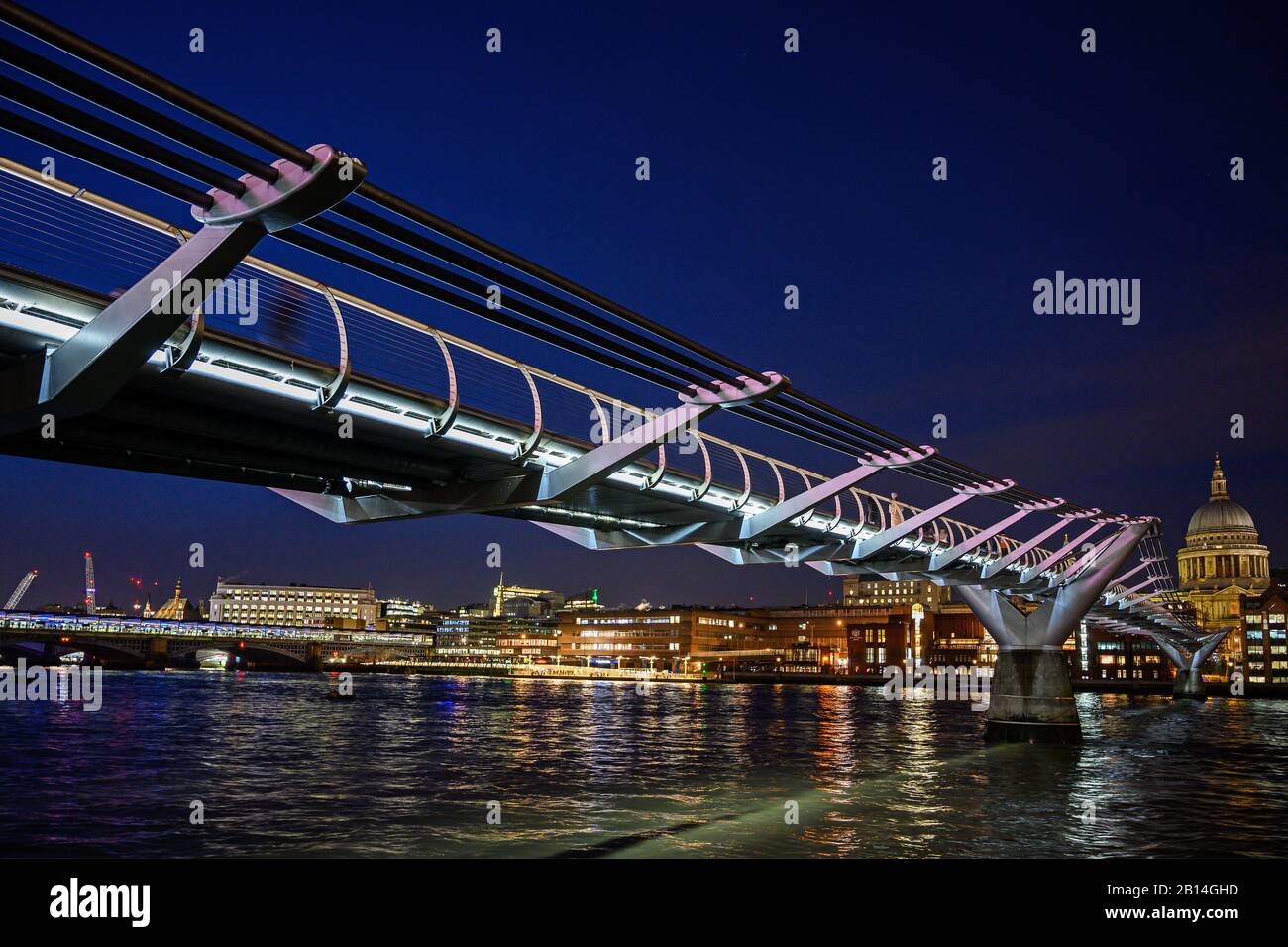 Night view of the Millennium Bridge and St Paul's Cathedral in London, UK. View over the River Thames to two of London's famous landmarks 2020. Stock Photo