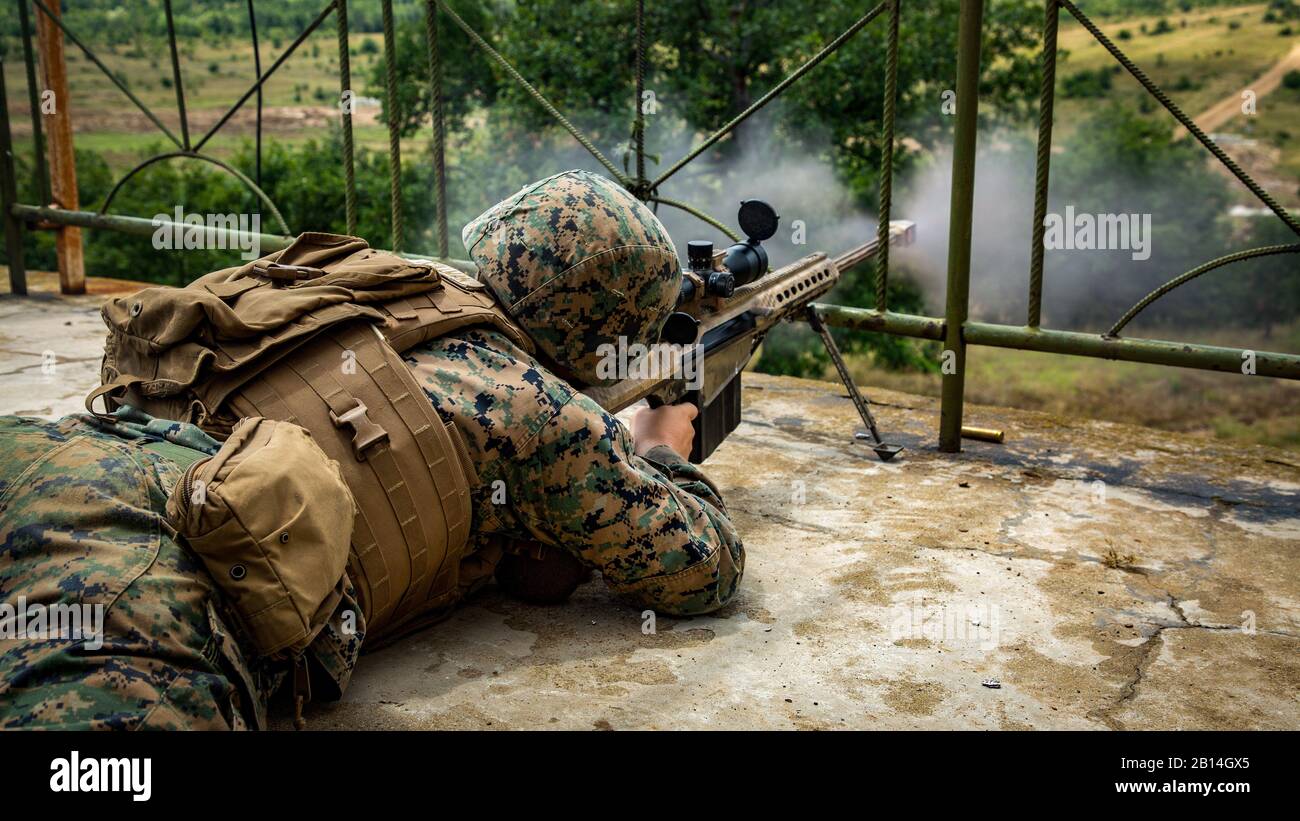 A U.S. Marine with Black Sea Rotational Force 18.1 engages targets with an M82 .50-caliber sniper rifle during a deployment for training exercise at Novo Selo Training Area, Bulgaria, July 5, 2018. Marines with Weapons Company, 1st Battalion, 6th Marine Regiment conducted five days of live-fire ranges, enhancing their operational capabilities (U.S. Marine Corps photo by Cpl. Alexander Sturdivant) Stock Photo
