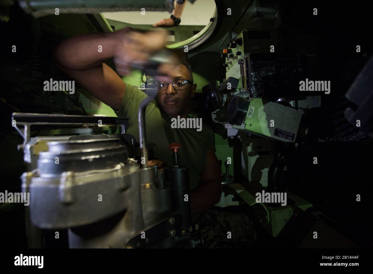 U.S. Marine Corps Cpl. Octavious Lee, a driver with Weapons Company, Battalion Landing Team, 2nd Battalion, 1st Marines, 31st Marine Expeditionary Unit, conducts assembly drills on a light armored vehicle’s M242 Bushmaster chain gun aboard the amphibious assault ship USS Wasp (LHD 1) in the Coral Sea, August 2, 2019. Wasp, flagship of the Wasp Amphibious Ready Group, with embarked 31st MEU, is operating in the Indo-Pacific region to enhance interoperability with partners and serve as ready-response force for any type of contingency, while simultaneously providing a flexible and lethal crisis r Stock Photo