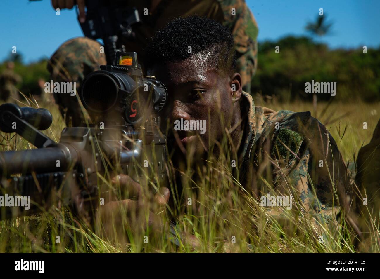 A U.S. Marine with the 31st Marine Expeditionary Unit's Maritime Raid Force holds security during a walkthrough rehearsal while conducting Military Operation on Urban Terrain training as part of Realistic Urban Training Exercise 19-1 on Marine Corps Base Hawaii, Kaneohe Bay, Hawaii, Jan. 23, 2019. RUTEX 19-1, the first iteration of the exercise that the 31st MEU has conducted in Hawaii, will incorporate scenarios and considerations that the Marines and Sailors of the MRF will factor into any real-world situation in an urban environment and will allow them to integrate with local law enforcemen Stock Photo
