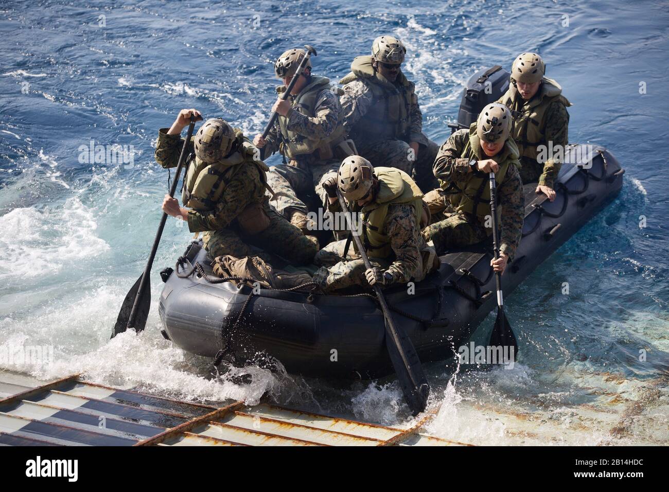 U.S. Marines with Alpha Company, Battalion Landing Team, 1st Battalion, 4th Marine Regiment, the 'China Marines,' launch a Combat Rubber Raiding Craft during a simulated boat raid aboard the dock landing ship USS Ashland (LSD 48) in the Philippine Sea Jan. 25, 2019. Alpha Company Marines are the small boat raid specialists for BLT 1/4, the Ground Combat Element for the 31st Marine Expeditionary Unit. The 31st MEU, the Marine Corps’ only continuously forward-deployed MEU partnering with the Wasp Amphibious Ready Group, provides a flexible and lethal force ready to perform a wide range of milit Stock Photo