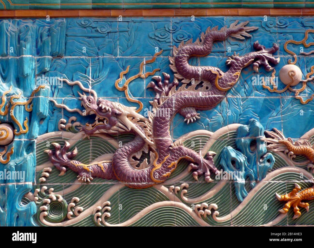 Nine-Dragon Walll，Beihai Park, Beijing, China. Built in Qianlong 21 years (1756),5.96 meters high,1.6 meters thick and 25.52 meters long. Stock Photo