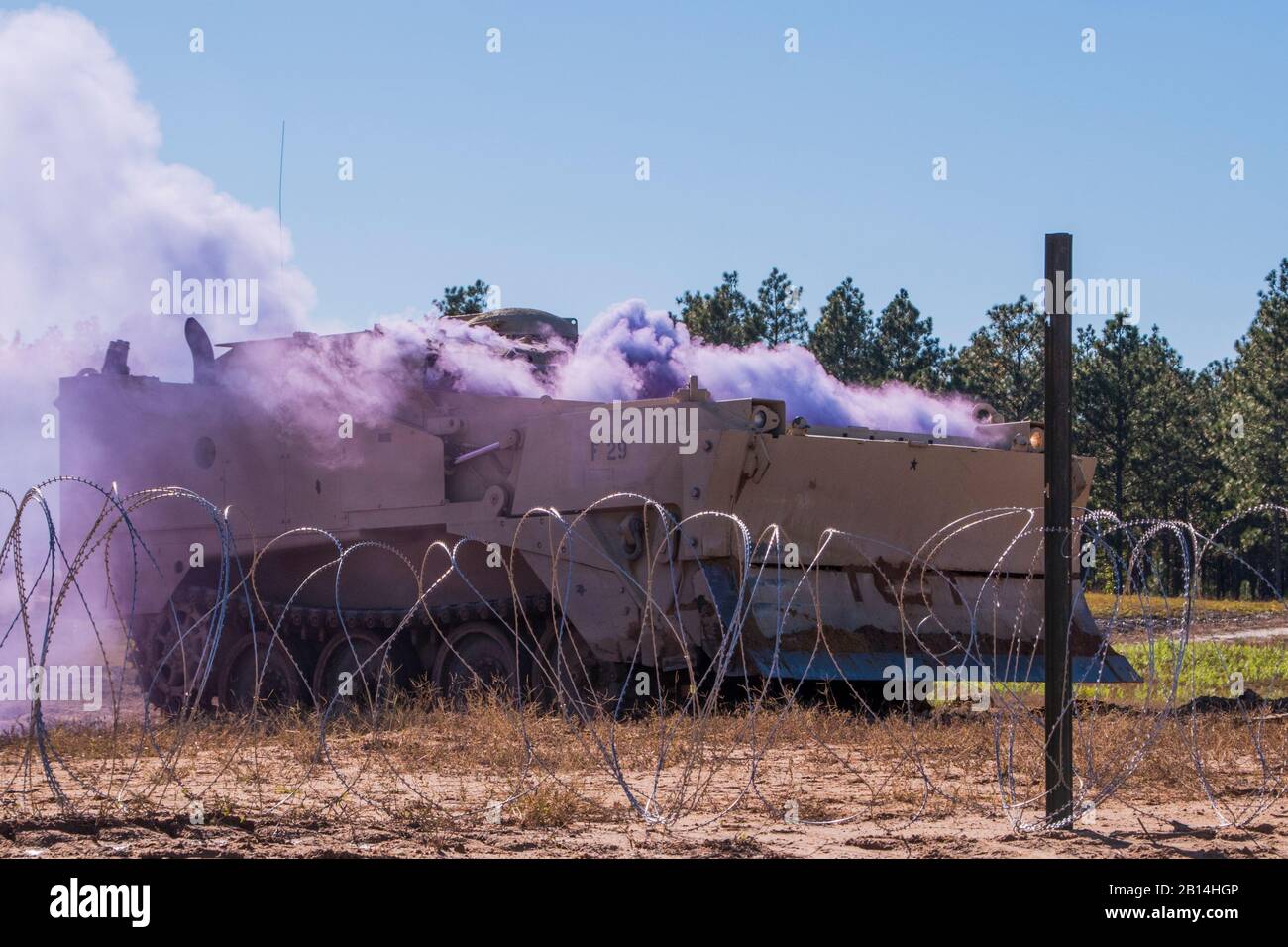 U.S. Soldiers assigned to the South Carolina Army National Guard's 4th Battalion, 118th Infantry Regiment, 218th Maneuver Enhancement Brigade and 174th Engineer Company conduct combined arms breaching exercises at McCrady Training Center in Eastover, South Carolina, Nov. 3, 2018.  The infantry companies practiced attacking an objective using support from the 174th engineer mobility assault platoons for obstacle reduction, destruction and short-gap crossings. The combined forces breached wired obstacles using simulated M58 Mine Clearing Line Charge (MICLIC) rockets, cleared minefields with an M Stock Photo