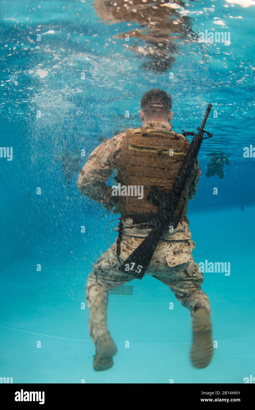 U.S. Marines assigned to the 2nd Marine Aircraft Wing participate in Water Survival-Advanced training at Marine Corps Air Station Cherry Point, N.C., July 29, 2017. WSA is a course that tests Marines on rescues, strokes and distance swimming. (U.S. Marine Corps photo by Lance Cpl. Jailine Martinez) Stock Photo