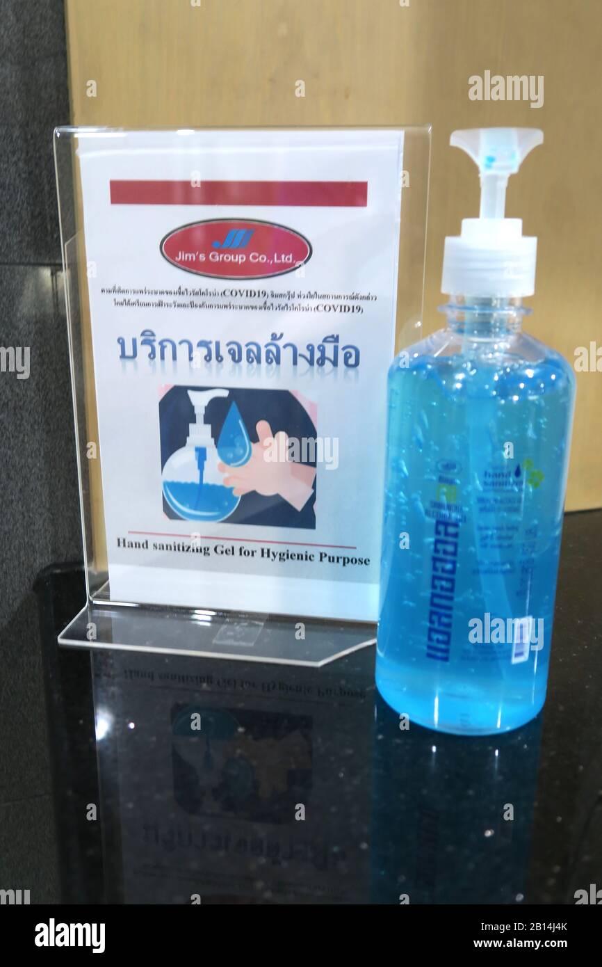Hand sanitiser gel and COVID-19 warning, Bangkok, Thailand Stock Photo