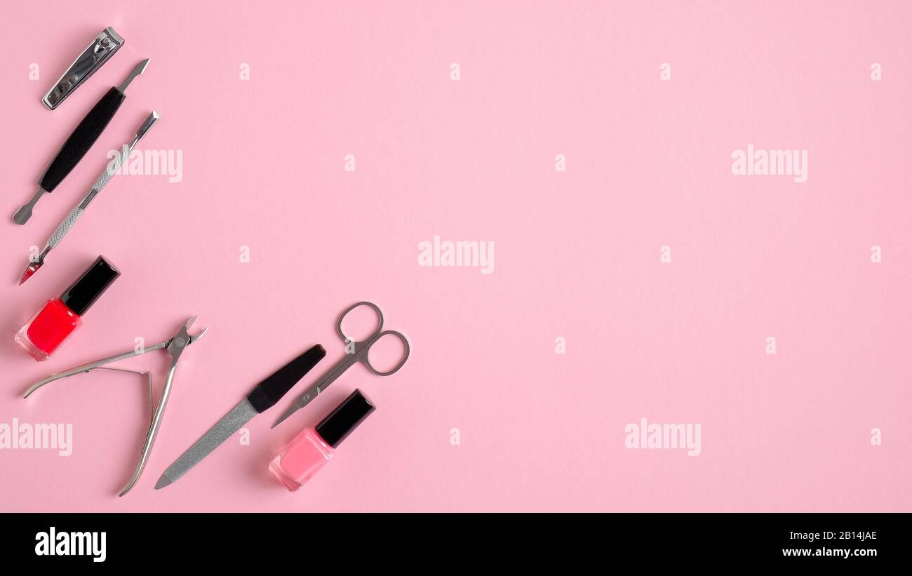 Manicure and pedicure tools on pink background, view from above. Nail salon  banner design template. Beauty treatment concept Stock Photo - Alamy
