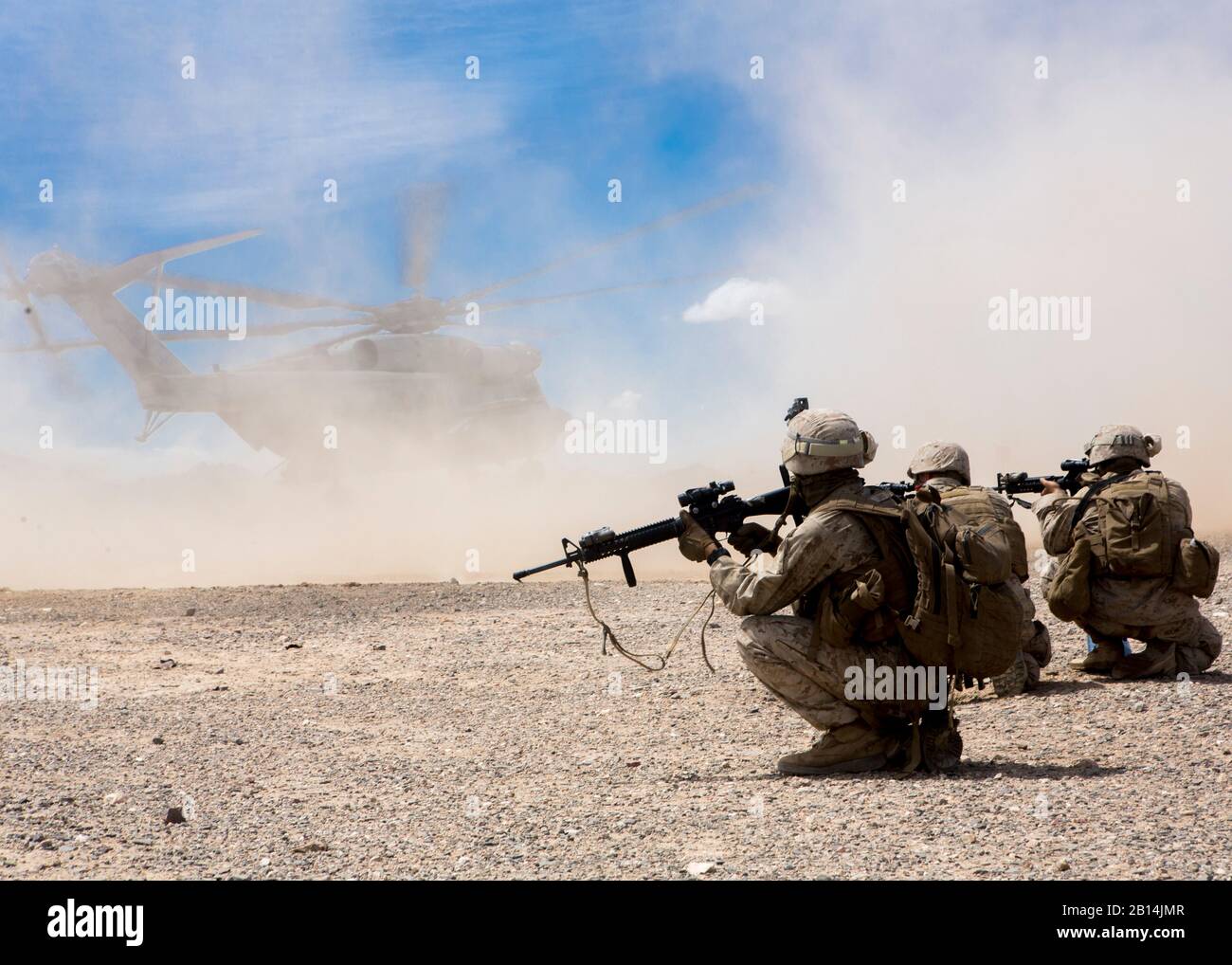 U.S. Marines with Bravo Battery, 1st Battalion, 10th Marine Regiment, 2nd Marine Division provide security during a CH-53 day battle drill in support of Weapons and Tactics Instructors course (WTI) 2-17 at Fire Base Burt. Calif., April 8, 2017. WTI is a seven-week training event hosted by Marine Aviation Weapons and Tactics Squadron One (MAWTS-1) cadre, which emphasizes operational integration of the six functions of Marine Corps aviation in support of a Marine Air Ground Task Force. WTI provides standardized advanced tactical training and certification of unit instructor qualifications to sup Stock Photo