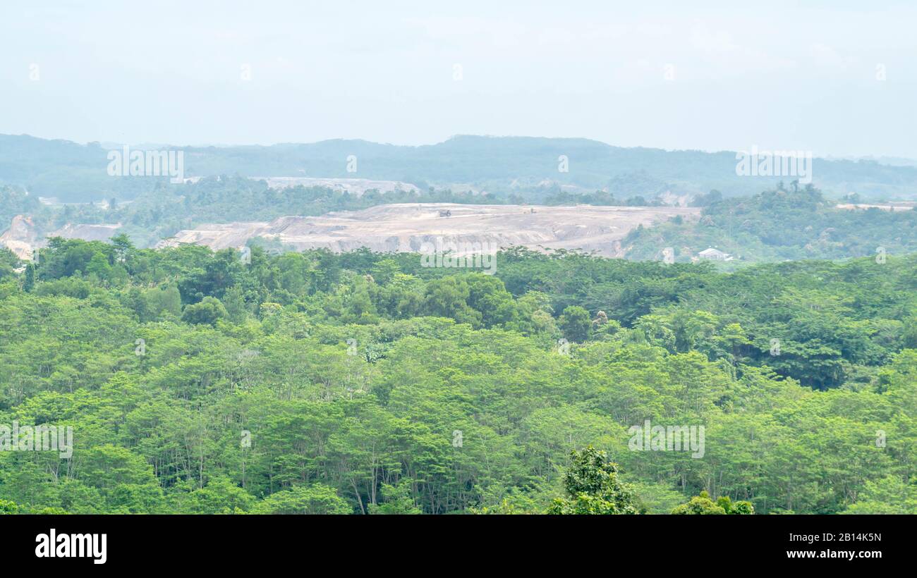 Open pit coal mining surrounded by tropical rain forest in Samarinda